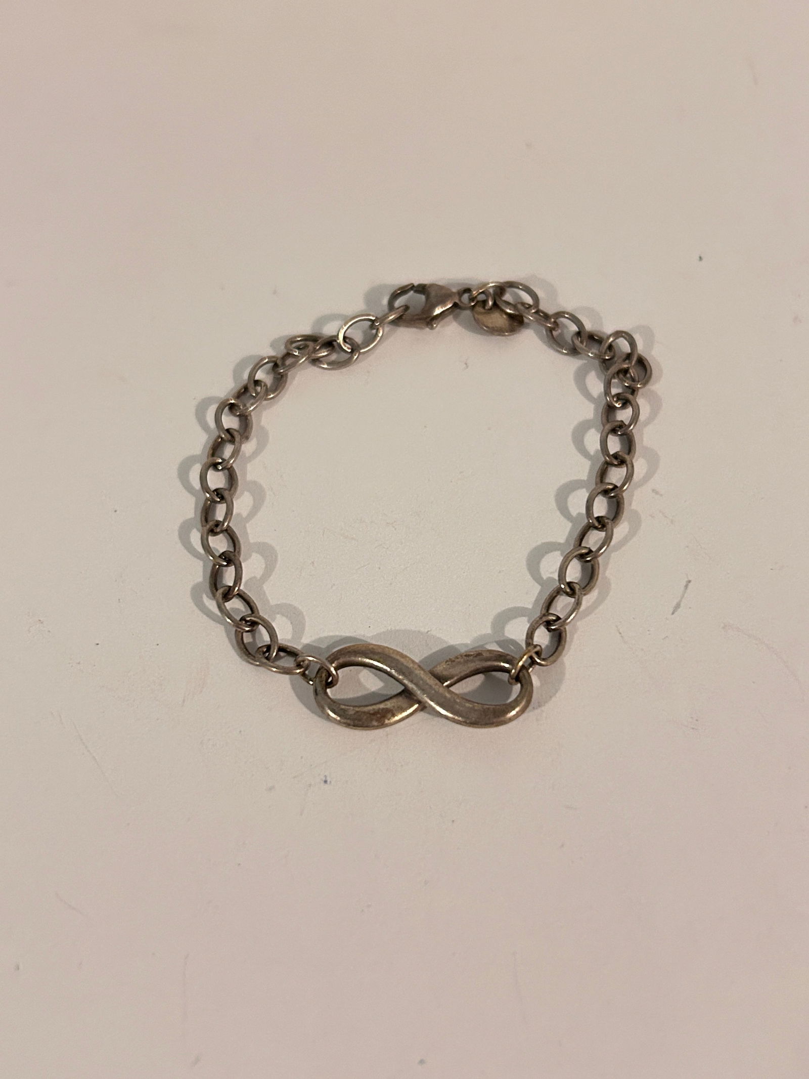 Tiffany & Co. Signed Sterling Silver 925 Infinity Bracelet Size 7: Tiffany & Co. Signed Sterling Silver 925 Infinity Bracelet Size 7” Please view all photos as they are part of the description and condition of this Item, Feel free to contact me with questions o