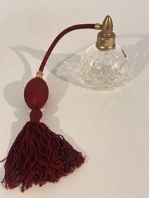 Waterford crystal perfume bottle with a red atomizer bulb and tassel