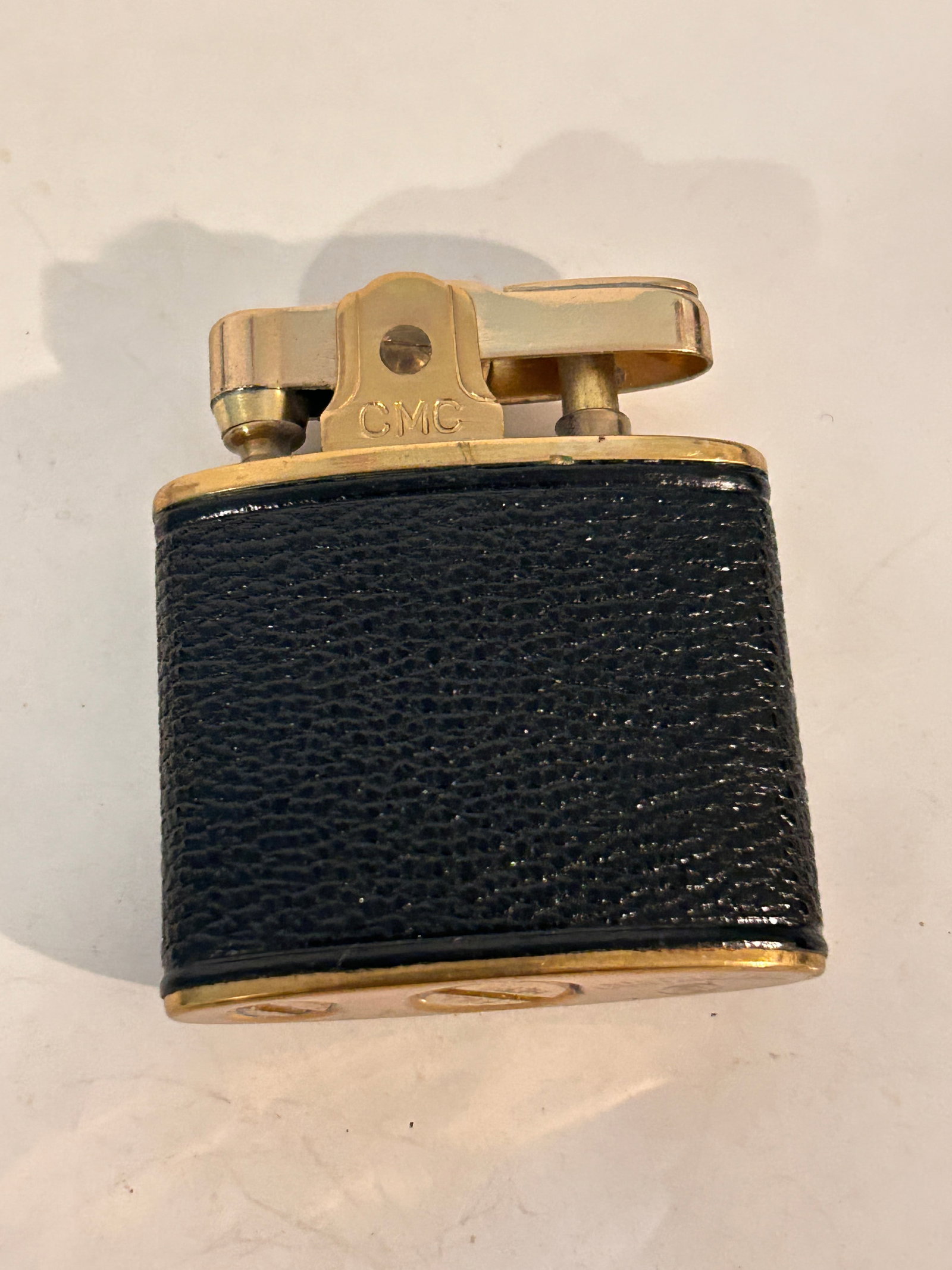 Vintage Continental CMC leather Cigarette gold tone Lighter: Vintage Continental CMC leather Cigarette gold tone Lighter Please view all photos as they are part of the description and condition of this Item, Feel free to contact me with questions or picture req
