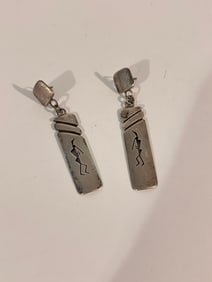 Native American sterling silver dangle earrings featuring a Kokopelli design