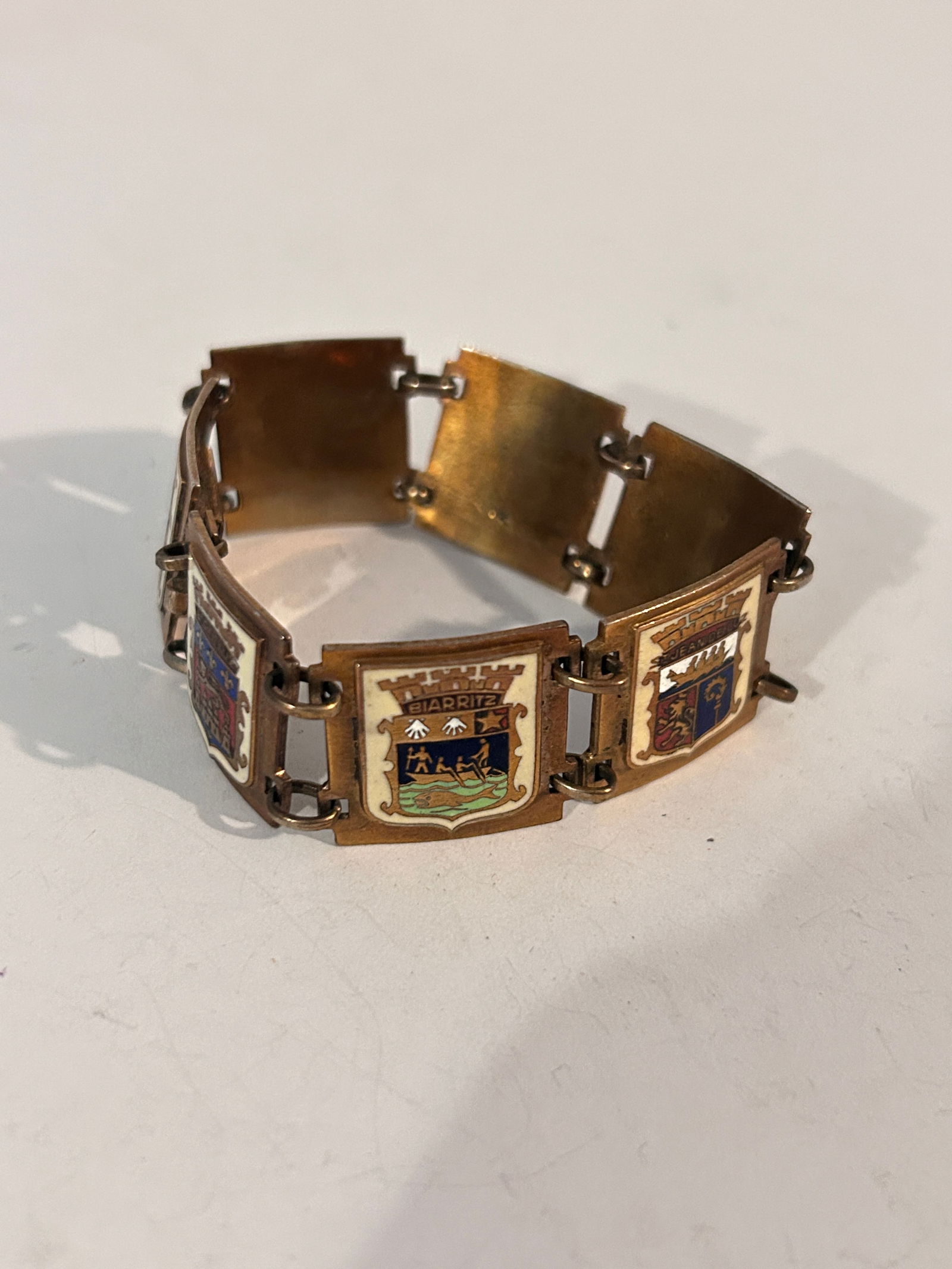 Vintage French enamel-on-brass souvenir bracelet featuring heraldic shields or landmarks of various (1 of 4)