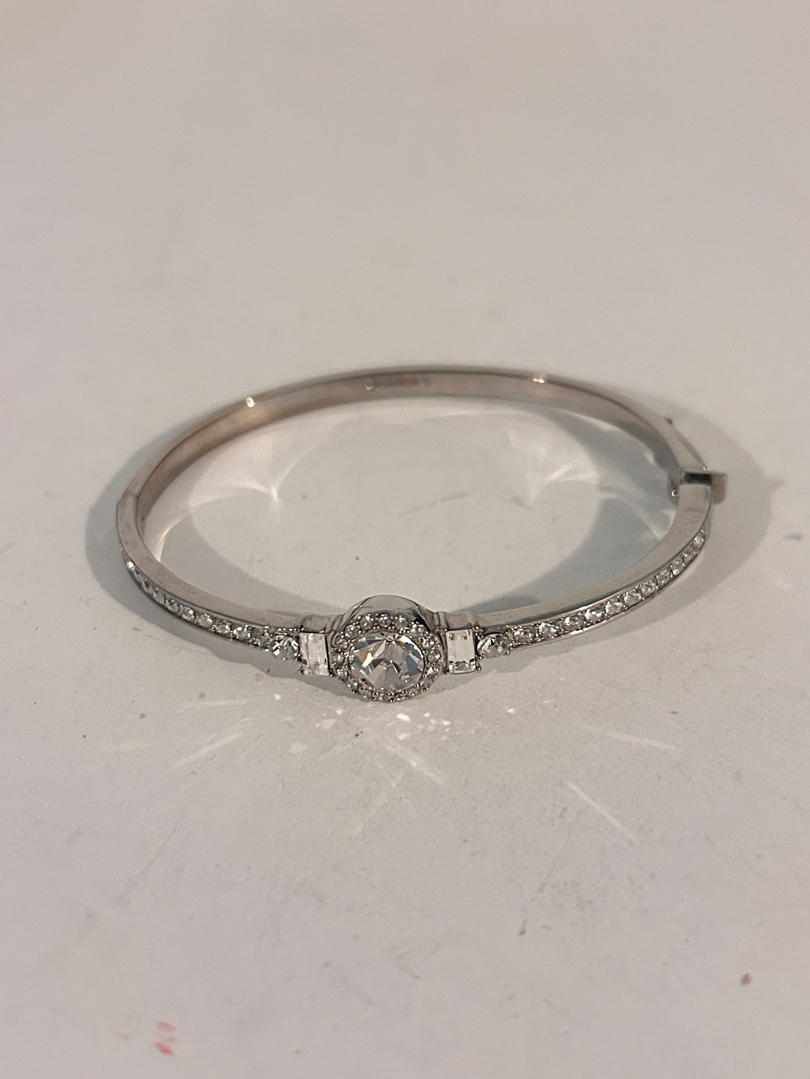 Givenchy Crystal Bangle Bracelet Silver Tone Halo Design 7" hinged: Givenchy Crystal Bangle Bracelet Silver Tone Halo Design 7" hinged Please view all photos as they are part of the description and condition of this Item, Feel free to contact me with questions or pict