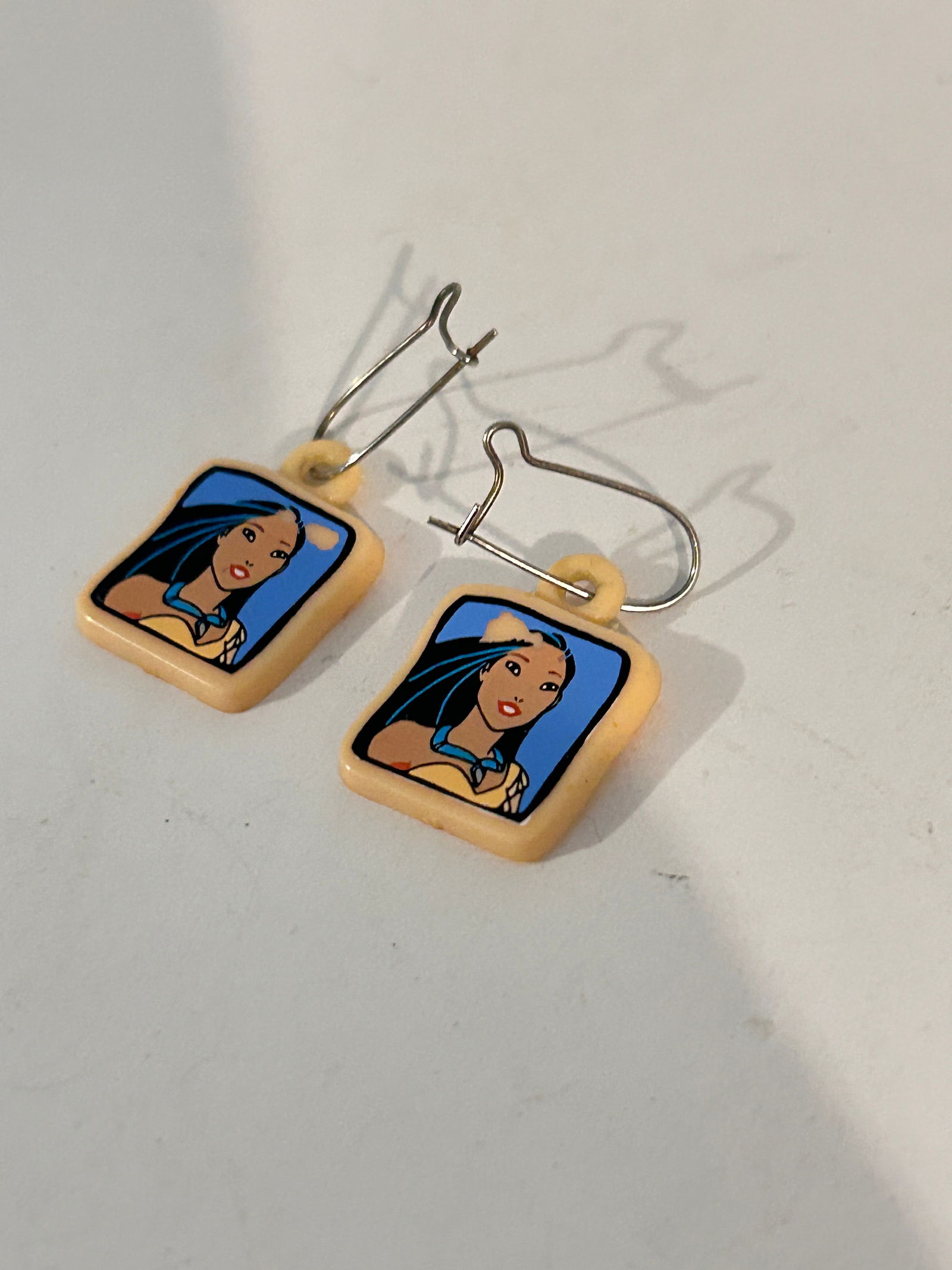 Vintage Pocahontas plastic Earrings: Vintage Pocahontas plastic Earrings Please view all photos as they are part of the description and condition of this Item, Feel free to contact me with questions or picture requests! Used Item AS IS