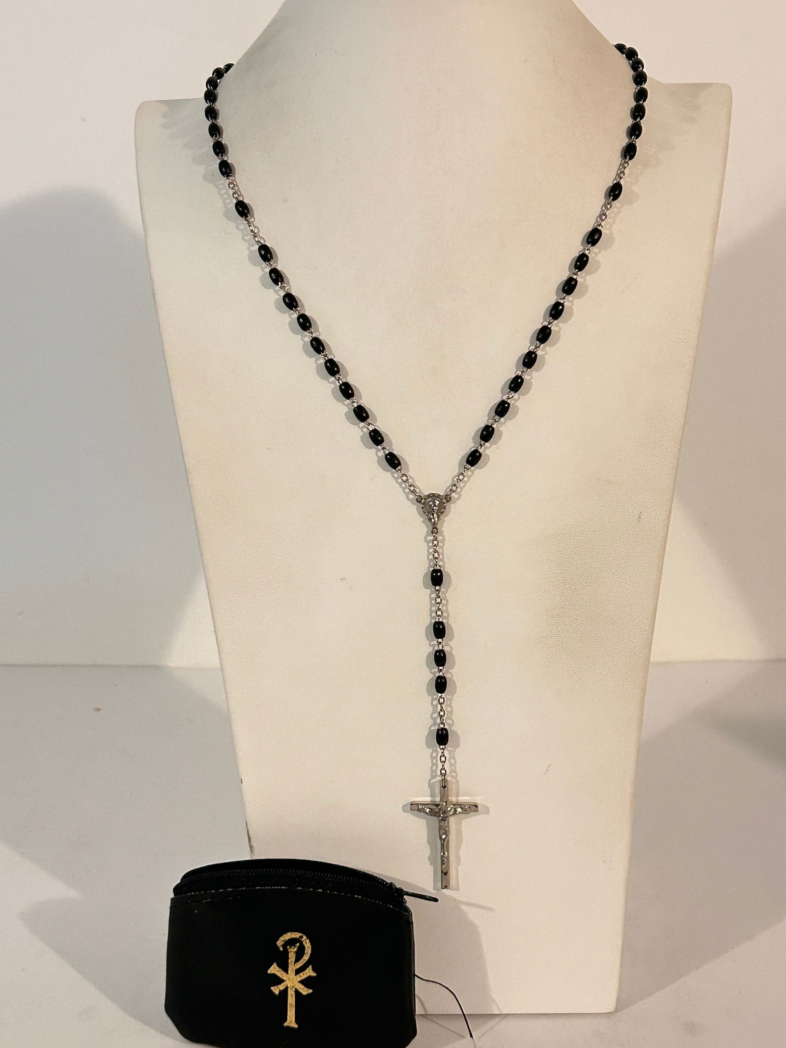 black bead rosary with a silver-toned crucifix and centerpiece 24": black bead rosary with a silver-toned crucifix and centerpiece 24" Please view all photos as they are part of the description and condition of this Item, Feel free to contact me with questions or pict