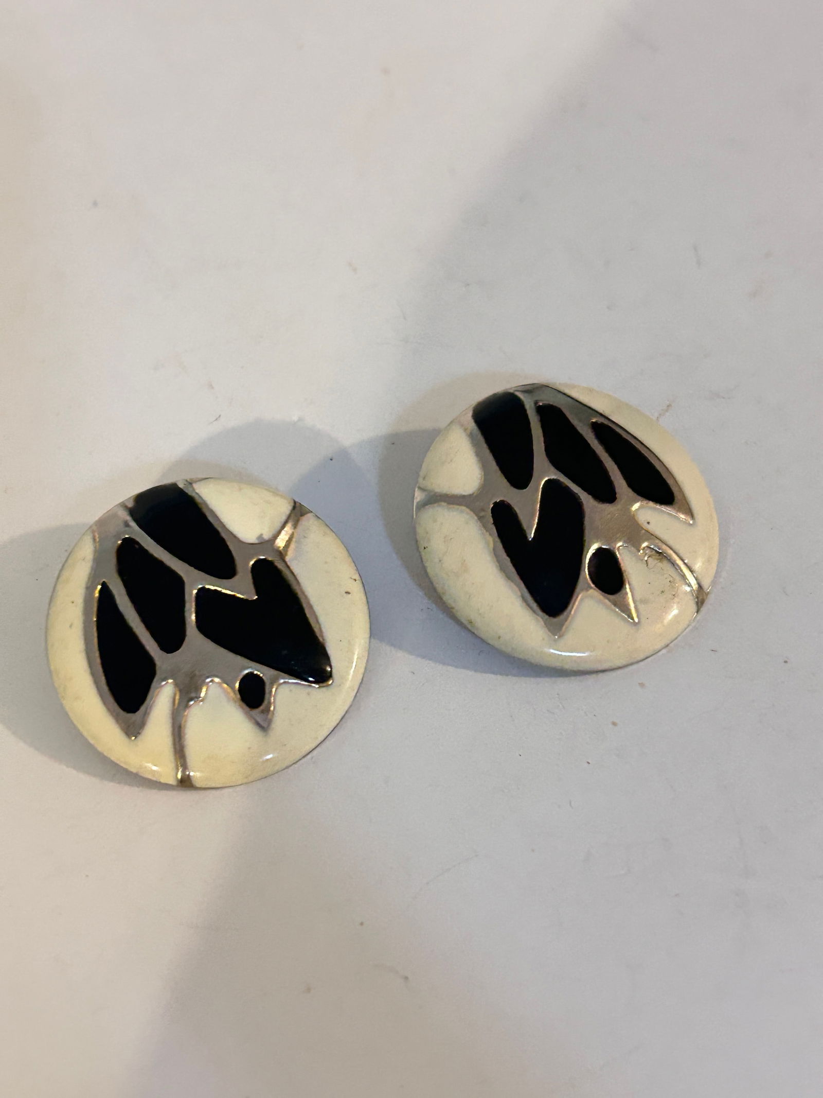 vintage enamel and metal stud earrings.: vintage enamel and metal stud earrings. Please view all photos as they are part of the description and condition of this Item, Feel free to contact me with questions or picture requests! Used Item AS