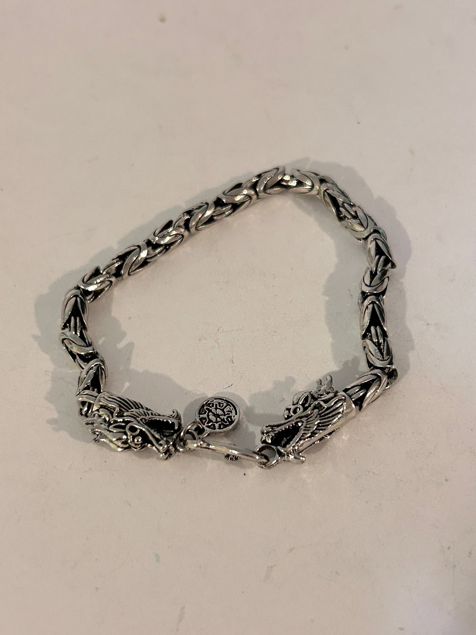 Byzantine chain bracelet with double dragon heads not sterling: Byzantine chain bracelet with double dragon heads not sterling Please view all photos as they are part of the description and condition of this Item, Feel free to contact me with questions or picture 