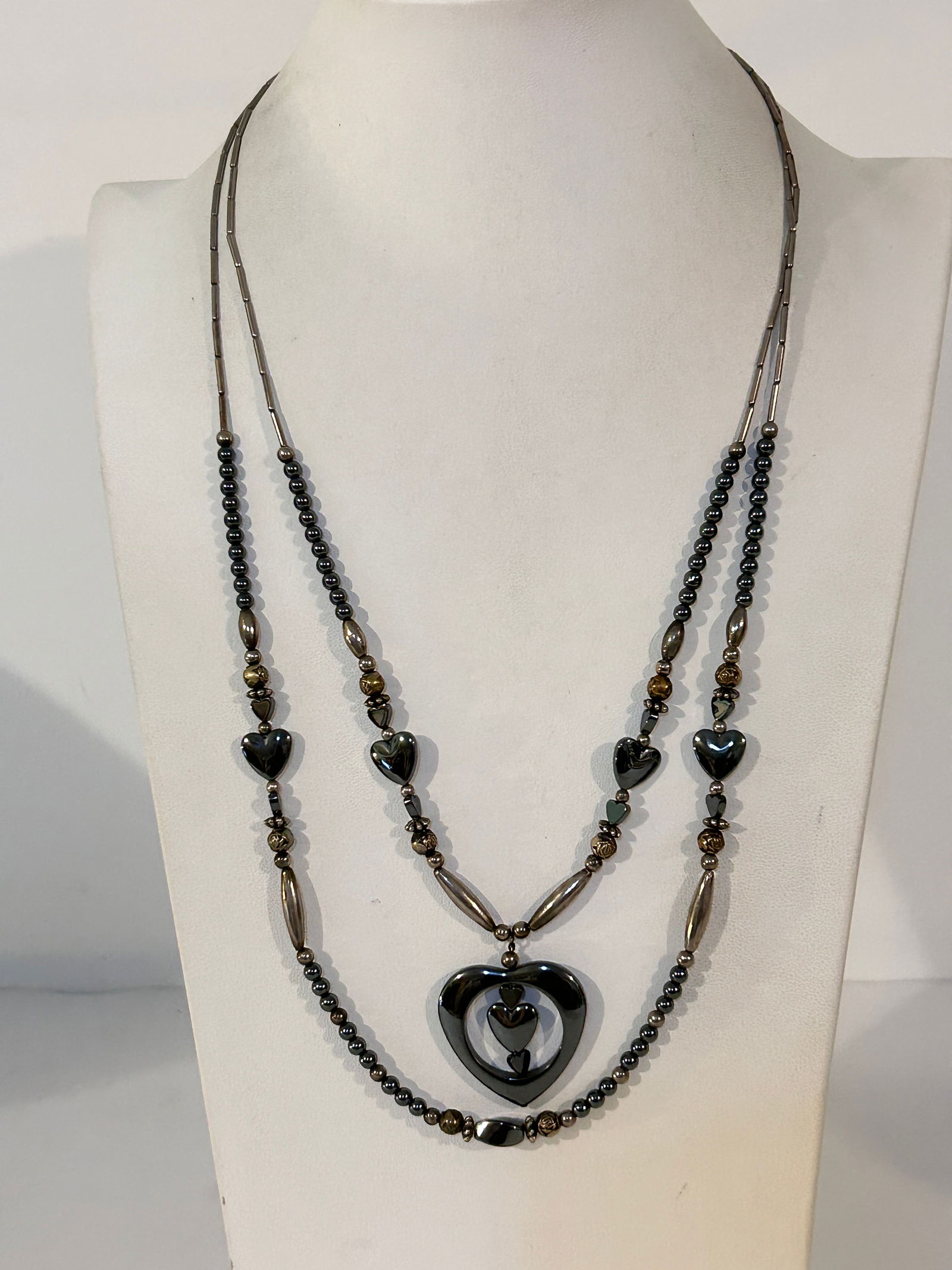 vintage or modern hematite beaded necklace with a heart-shaped pendant: vintage or modern hematite beaded necklace with a heart-shaped pendant Please view all photos as they are part of the description and condition of this Item, Feel free to contact me with questions or