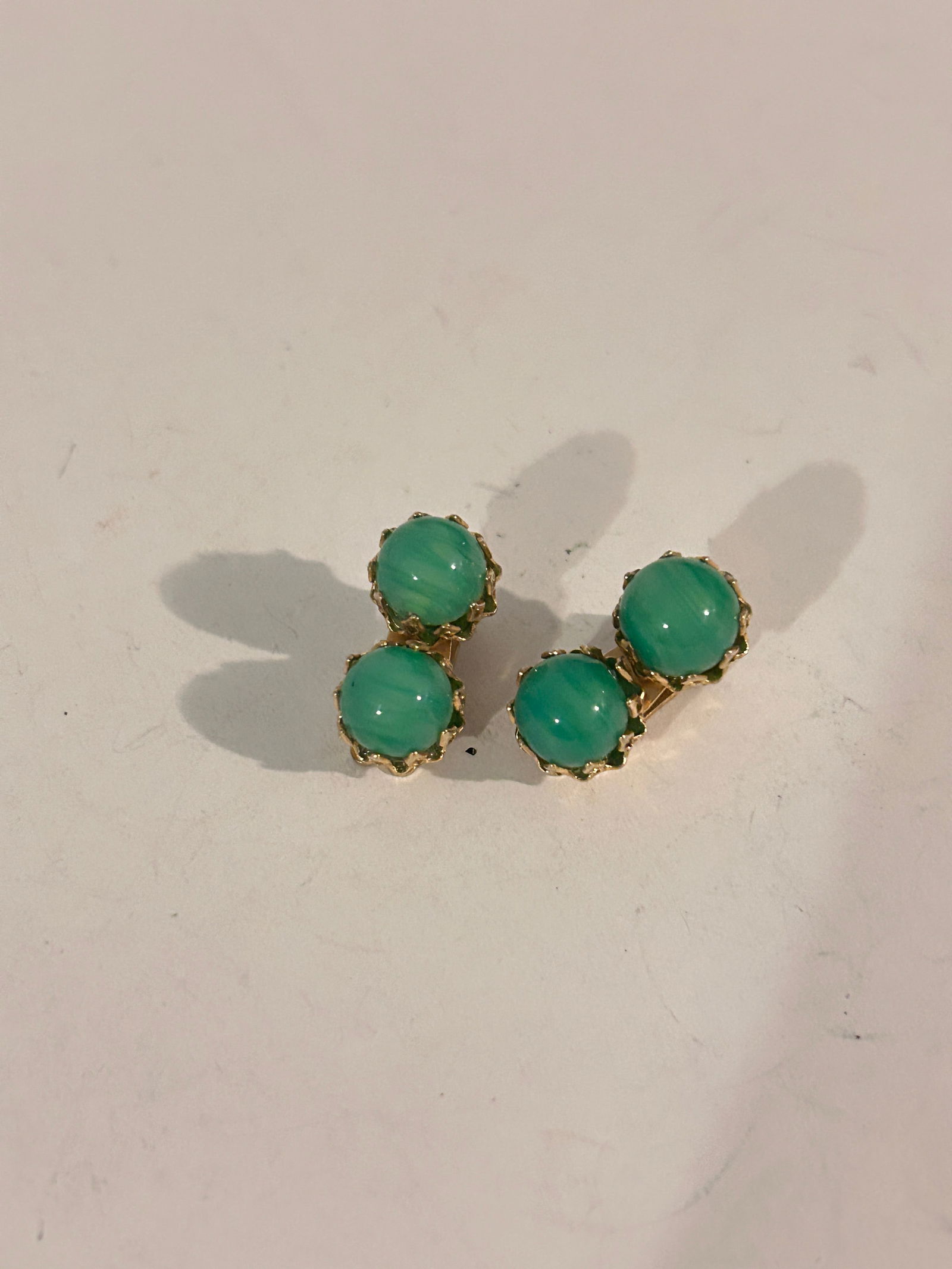 Vintage Signed VOGUE Gold-tone Green Glass Clip-on Earrings: Vintage Signed VOGUE Gold-tone Green Glass Clip-on Earrings Please view all photos as they are part of the description and condition of this Item, Feel free to contact me with questions or picture req