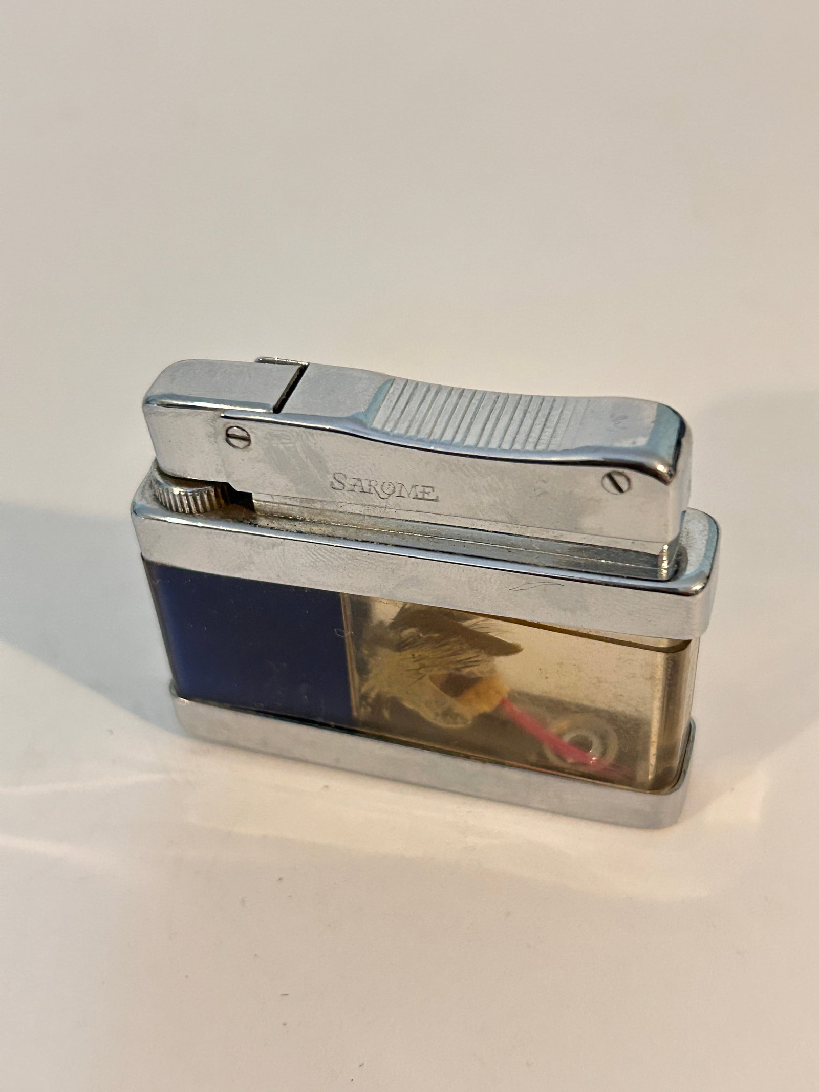 Vintage Sarome Liquid 4 petrol cigarette lighter manufactured by S.R.M. Mfg. Co. in Japan around the: Vintage Sarome Liquid 4 petrol cigarette lighter manufactured by S.R.M. Mfg. Co. in Japan around the 1950s Please view all photos as they are part of the description and condition of this Item, Feel f