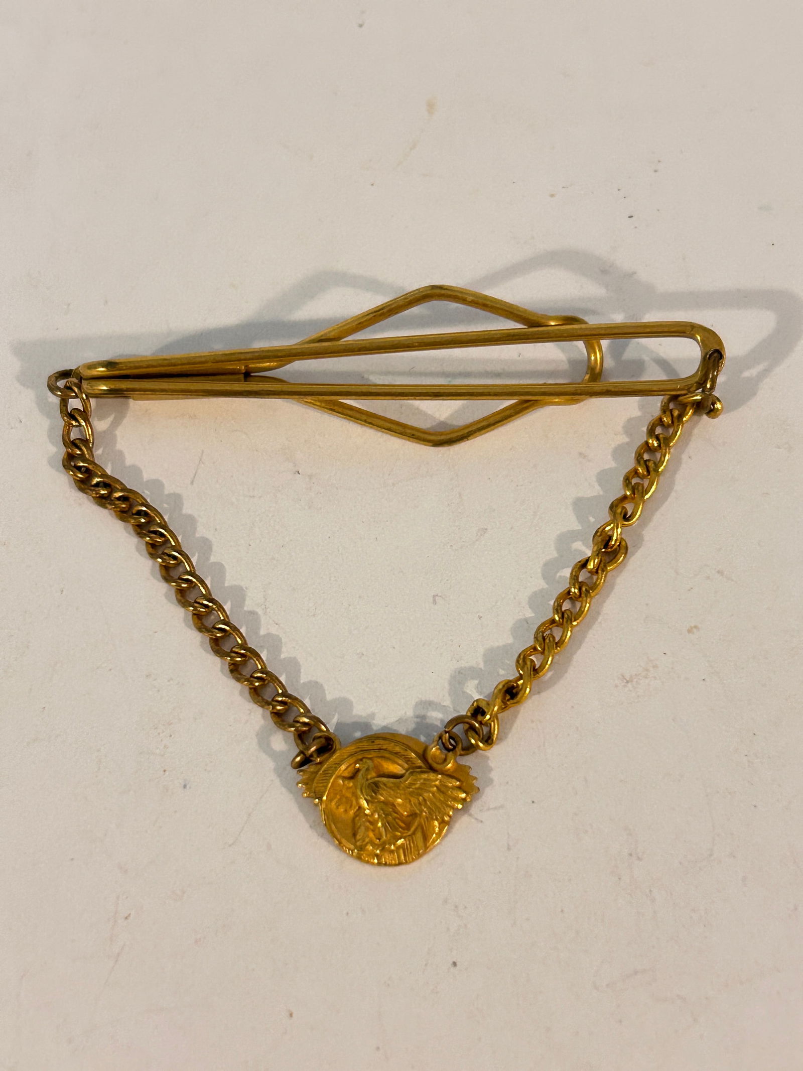 Vintage WW2 Honorable Discharge Ruptured Duck Tie Bar: Vintage WW2 Honorable Discharge Ruptured Duck Tie Bar Please view all photos as they are part of the description and condition of this Item, Feel free to contact me with questions or picture requests!