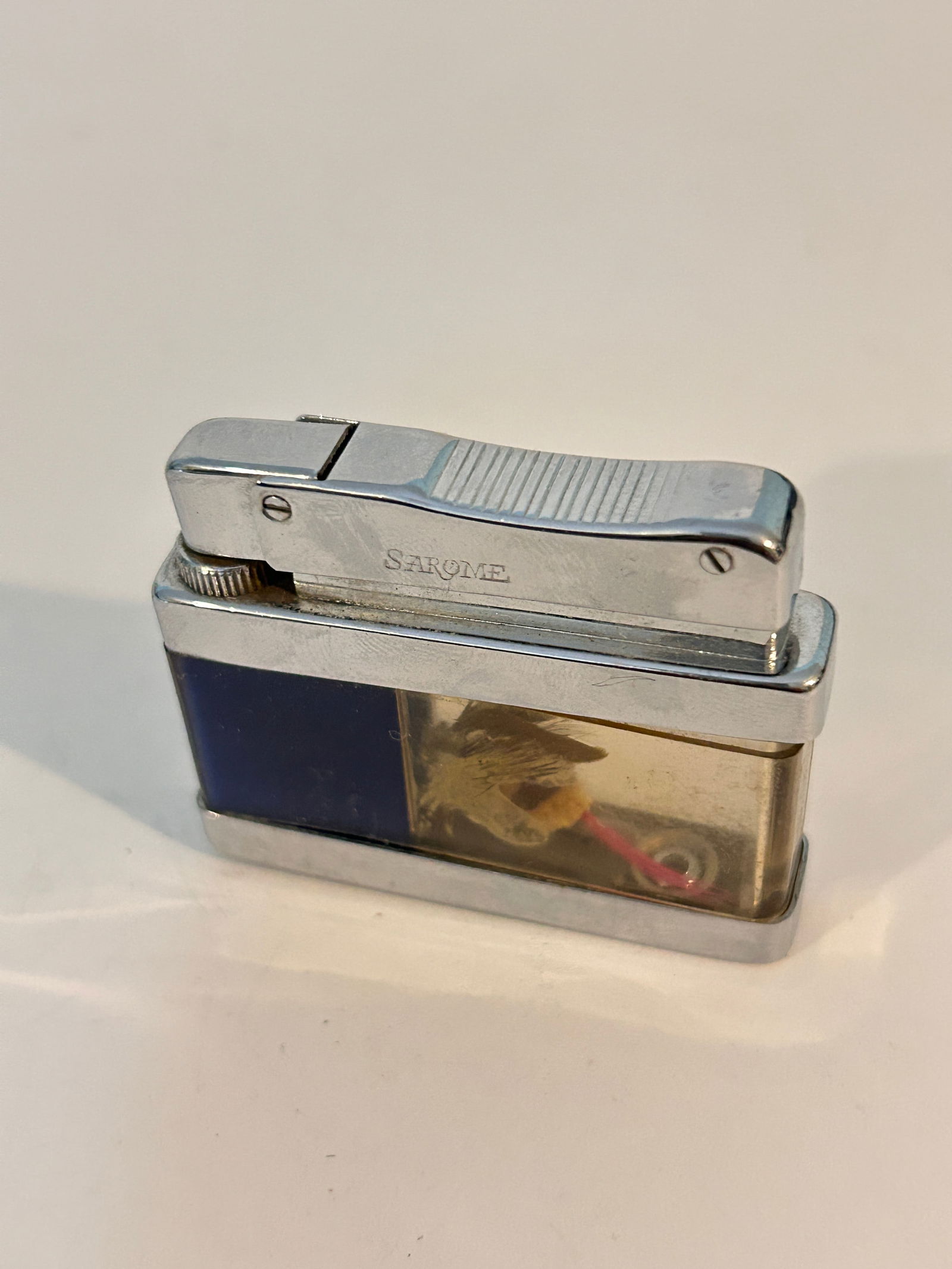 Vintage Sarome Liquid 4 petrol cigarette lighter manufactured by S.R.M. Mfg. Co. in Japan around the: Vintage Sarome Liquid 4 petrol cigarette lighter manufactured by S.R.M. Mfg. Co. in Japan around the 1950s Please view all photos as they are part of the description and condition of this Item, Feel f