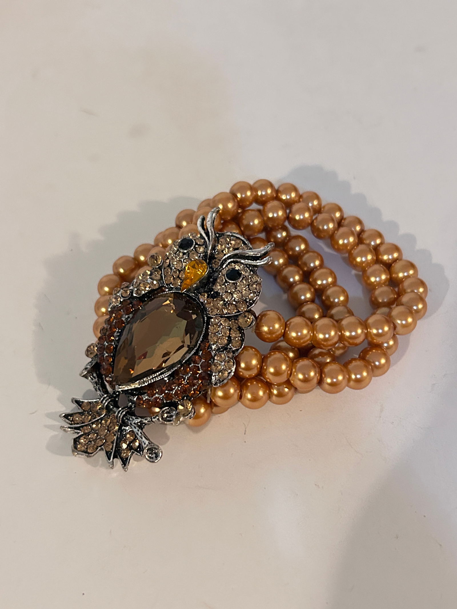 Vintage 4 strand Owl bead stretch Bracelet: Vintage 4 strand Owl bead stretch Bracelet Please view all photos as they are part of the description and condition of this Item, Feel free to contact me with questions or picture requests! Used Item