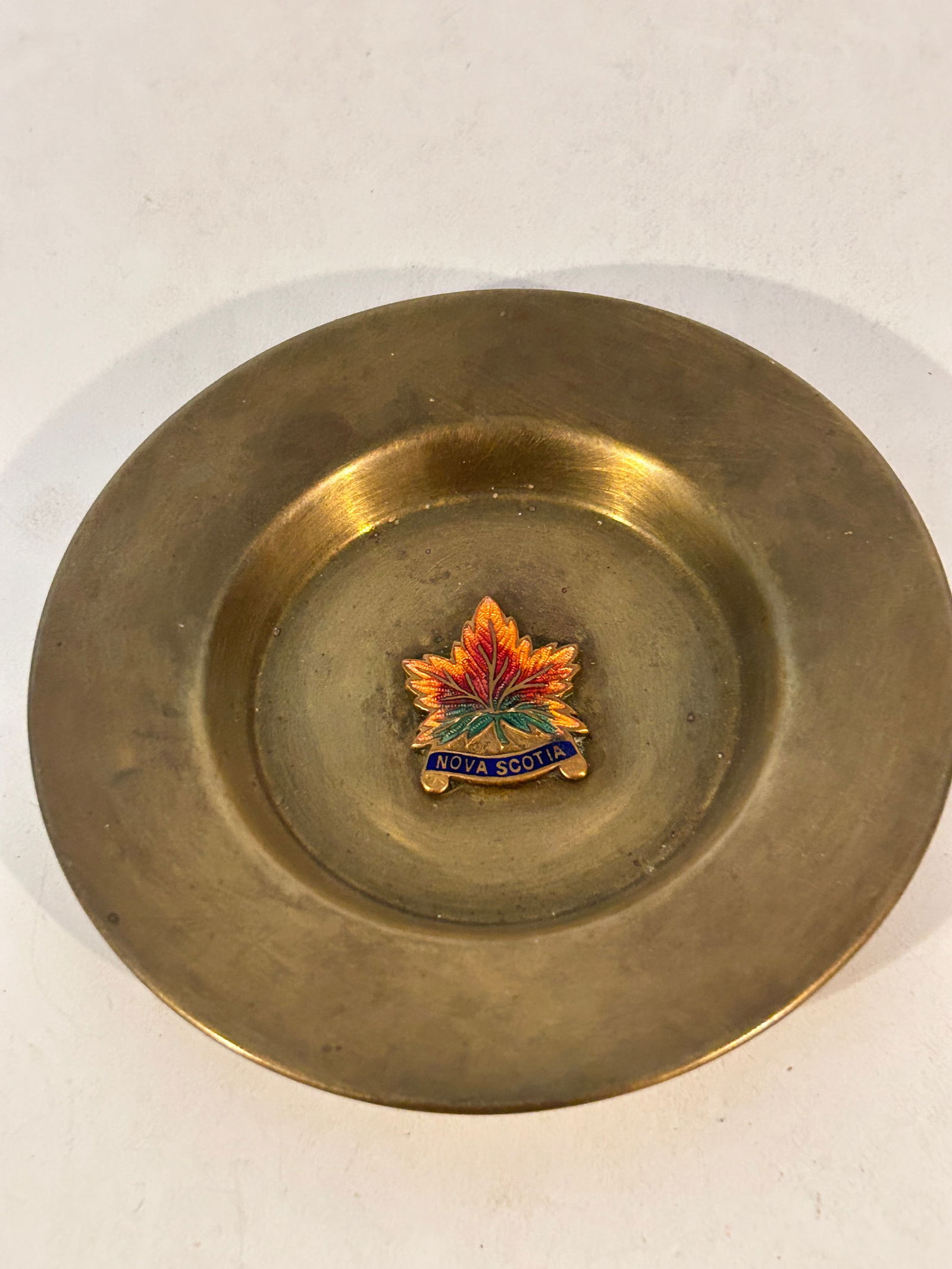 Vintage brass ashtray featuring an enamel maple leaf pin Nova Scotia 4": Vintage brass ashtray featuring an enamel maple leaf pin Nova Scotia 4" Please view all photos as they are part of the description and condition of this Item, Feel free to contact me with questions or