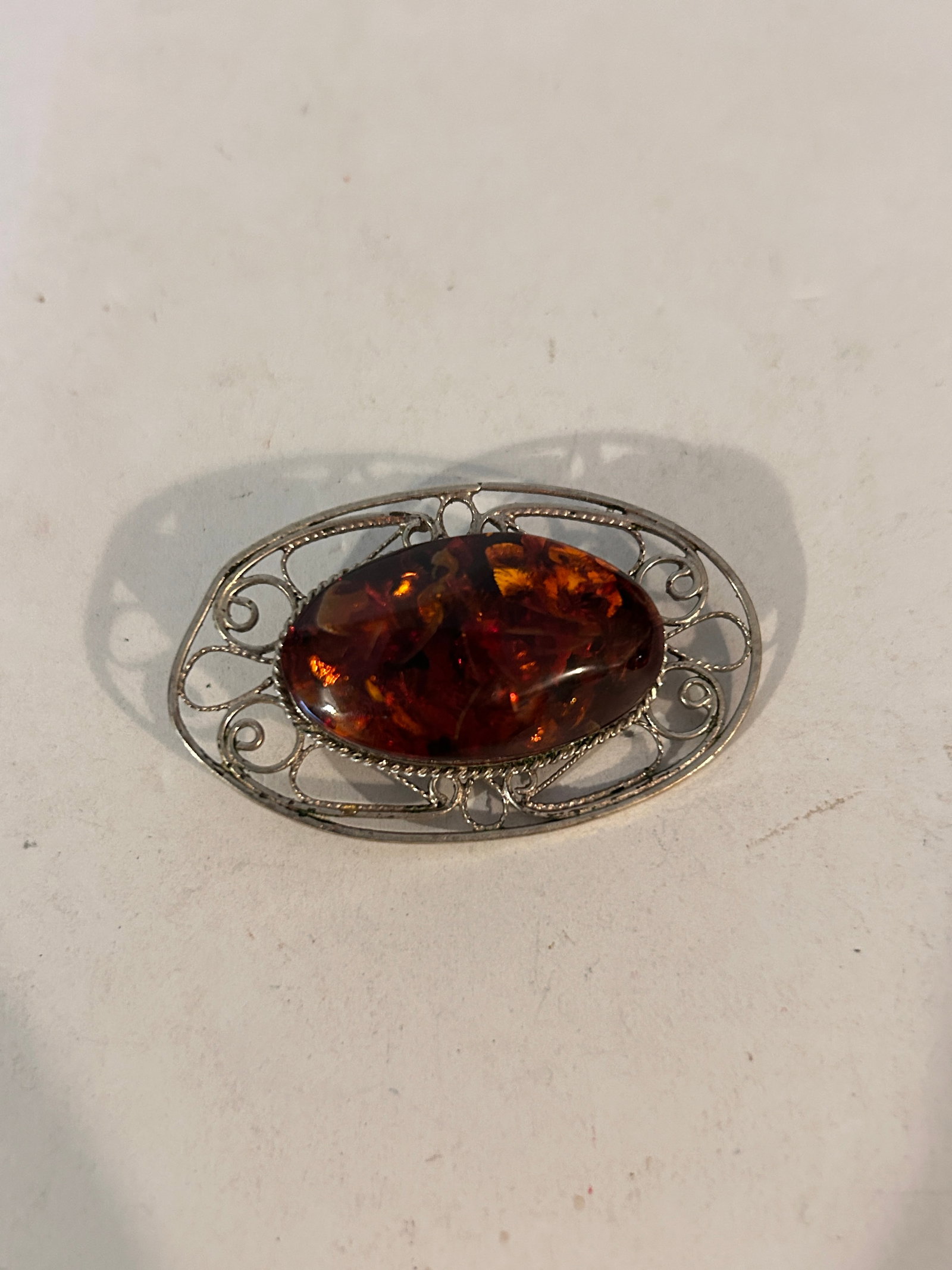 Vintage Silver Tone Faux Amber Brooch: Vintage Silver Tone Faux Amber Brooch Please view all photos as they are part of the description and condition of this Item, Feel free to contact me with questions or picture requests! Used Item AS IS