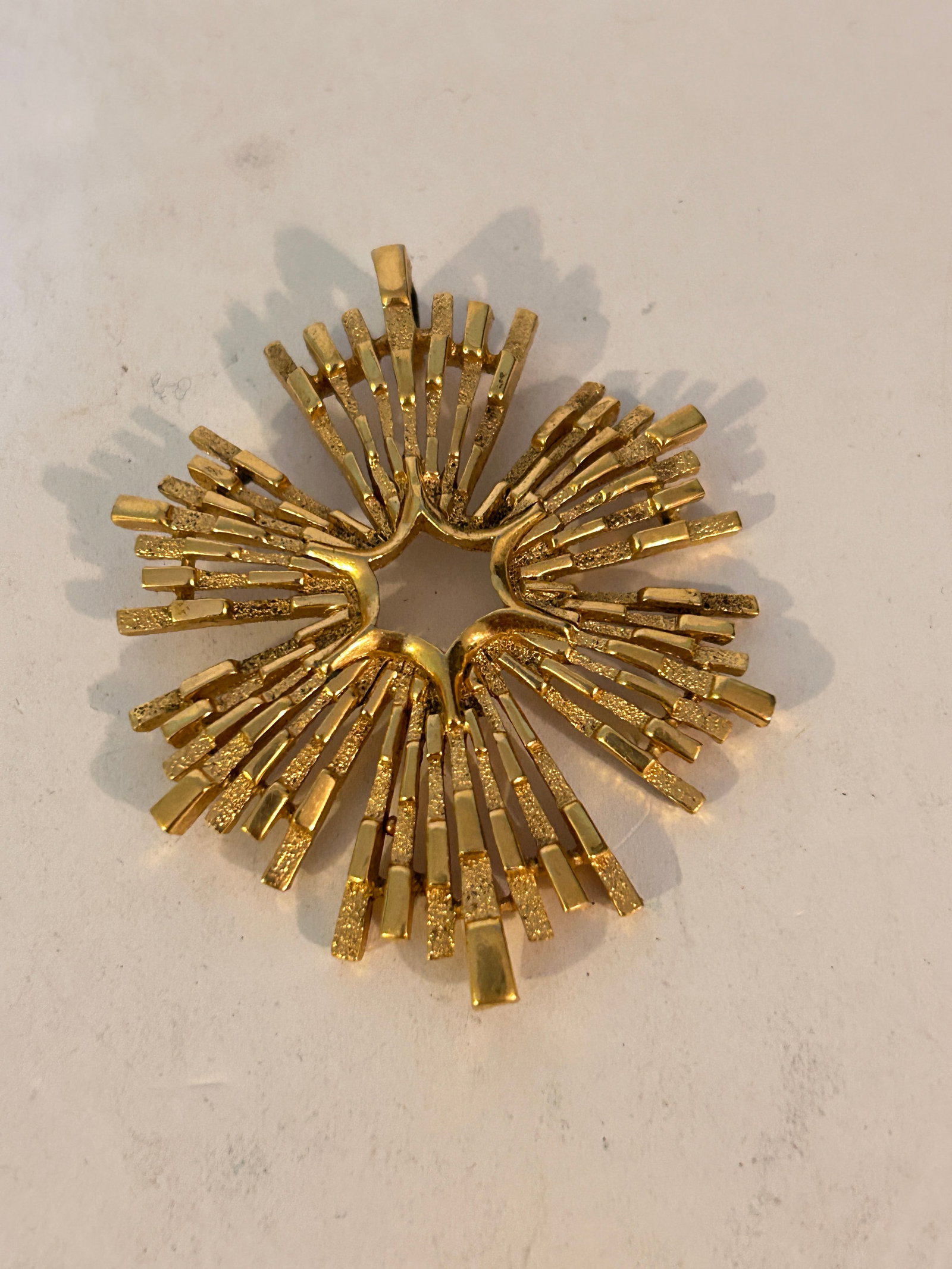 Vintage Crown Trifari Gold Tone Starburst Brutalist Pendant: Vintage Crown Trifari Gold Tone Starburst Brutalist Pendant Please view all photos as they are part of the description and condition of this Item, Feel free to contact me with questions or picture req