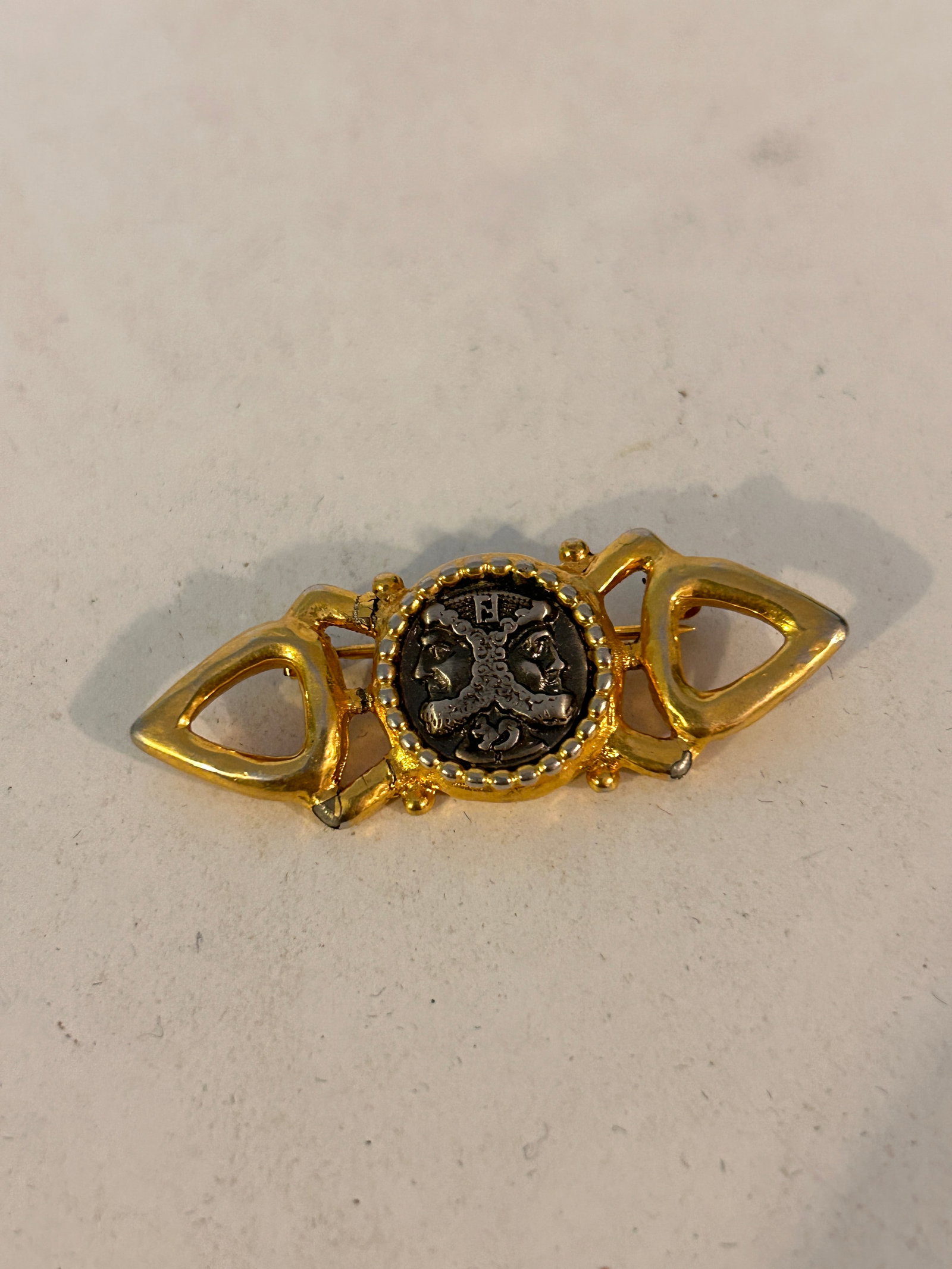 Vintage FENDI logo signed gold tone designer runway brooch: Vintage FENDI logo signed gold tone designer runway brooch Please view all photos as they are part of the description and condition of this Item, Feel free to contact me with questions or picture requ