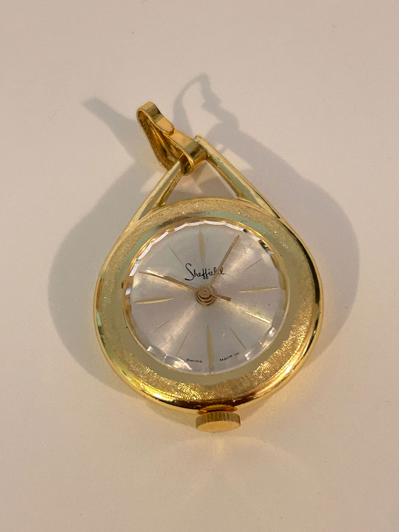 Vintage Sheffield Wind-up Analog Gold Tone Pocket Pendant Watch working: Vintage Sheffield Wind-up Analog Gold Tone Pocket Pendant Watch working Please view all photos as they are part of the description and condition of this Item, Feel free to contact me with questions or