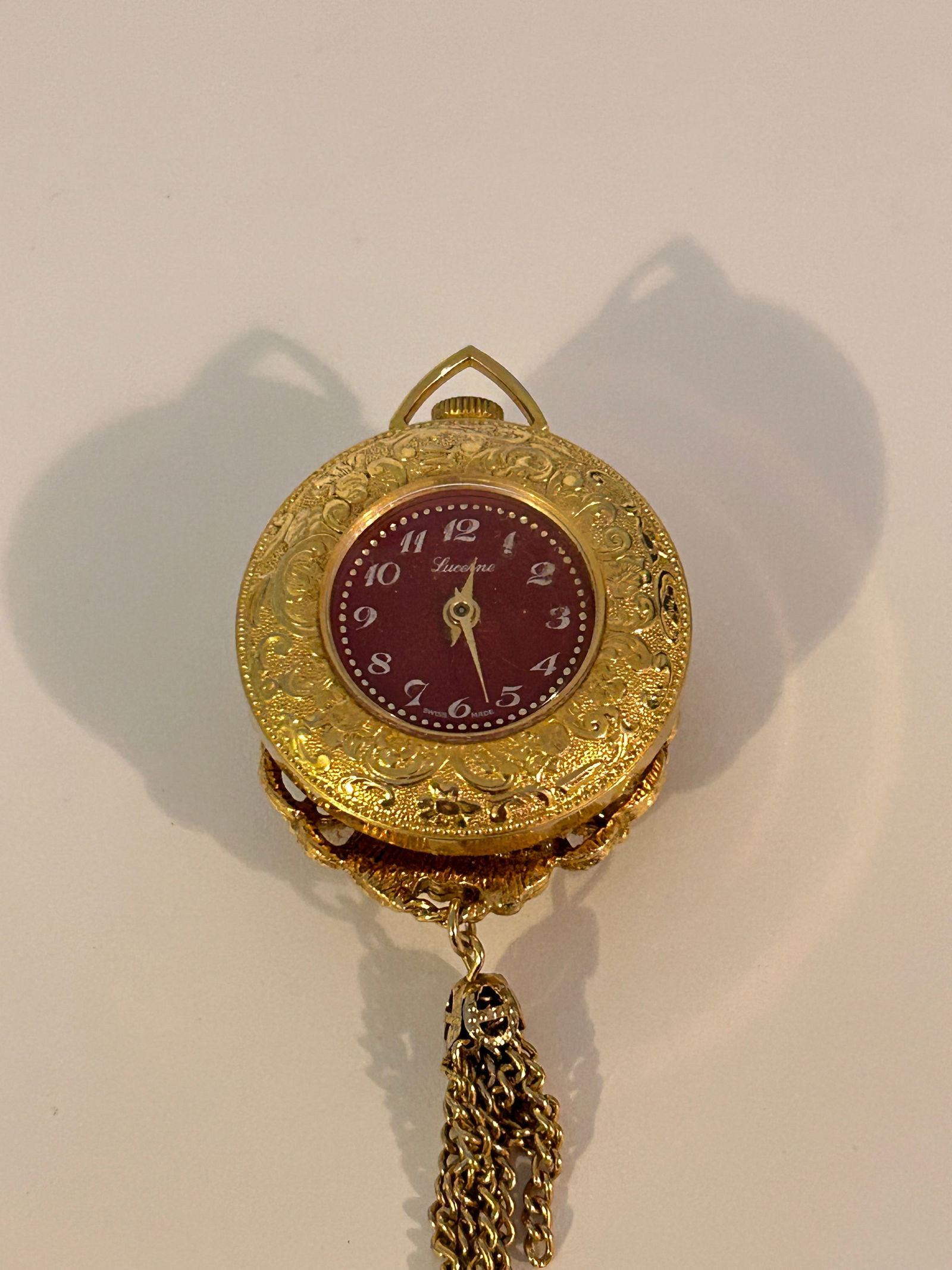 Vintage Lucerne Cameo Wind-up Analog Gold Tone Pocket Pendant Watch working: Vintage Lucerne Cameo Wind-up Analog Gold Tone Pocket Pendant Watch working Please view all photos as they are part of the description and condition of this Item, Feel free to contact me with question