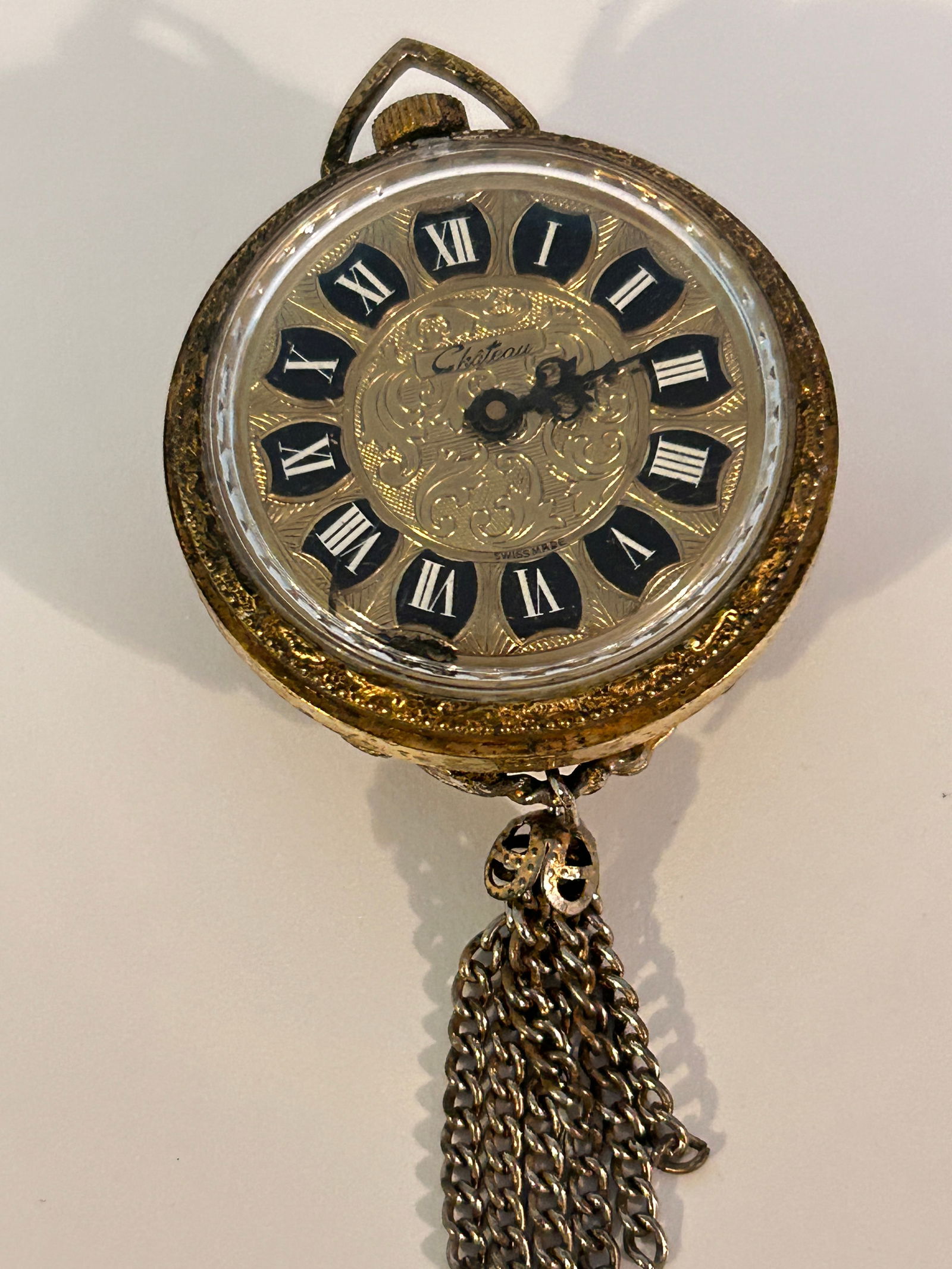 Vintage Chateau Gold Tone Cameo working Tassle Pendant Watch: Vintage Chateau Gold Tone Cameo working Tassle Pendant Watch Please view all photos as they are part of the description and condition of this Item, Feel free to contact me with questions or picture re