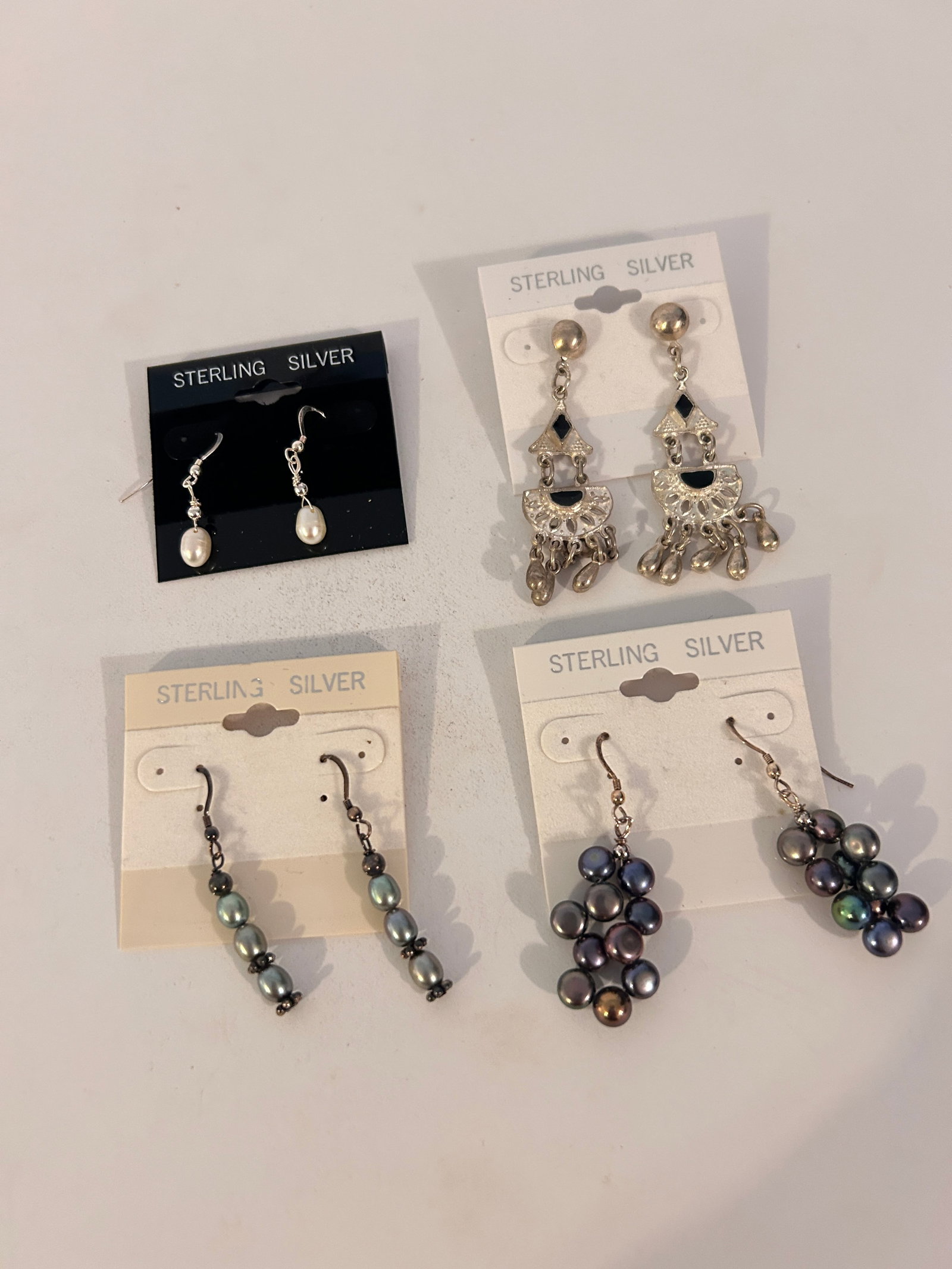 Vintage Lot of 4 Sterling Silver Earrings: Vintage Lot of 4 Sterling Silver Earrings Please view all photos as they are part of the description and condition of this Item, Feel free to contact me with questions or picture requests! Used Item A