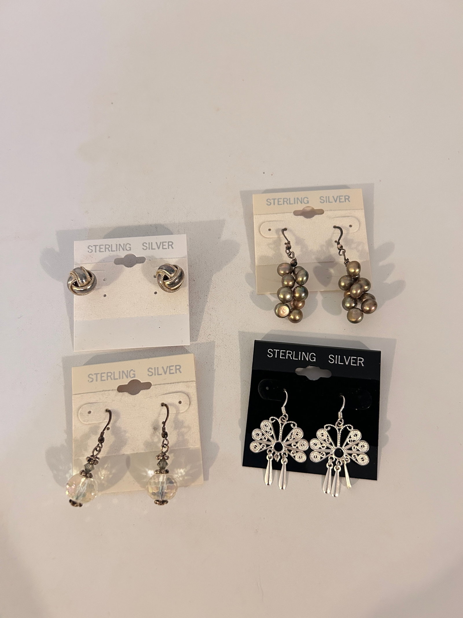 Vintage Lot of 4 Sterling Silver Earrings: Vintage Lot of 4 Sterling Silver Earrings Please view all photos as they are part of the description and condition of this Item, Feel free to contact me with questions or picture requests! Used Item A