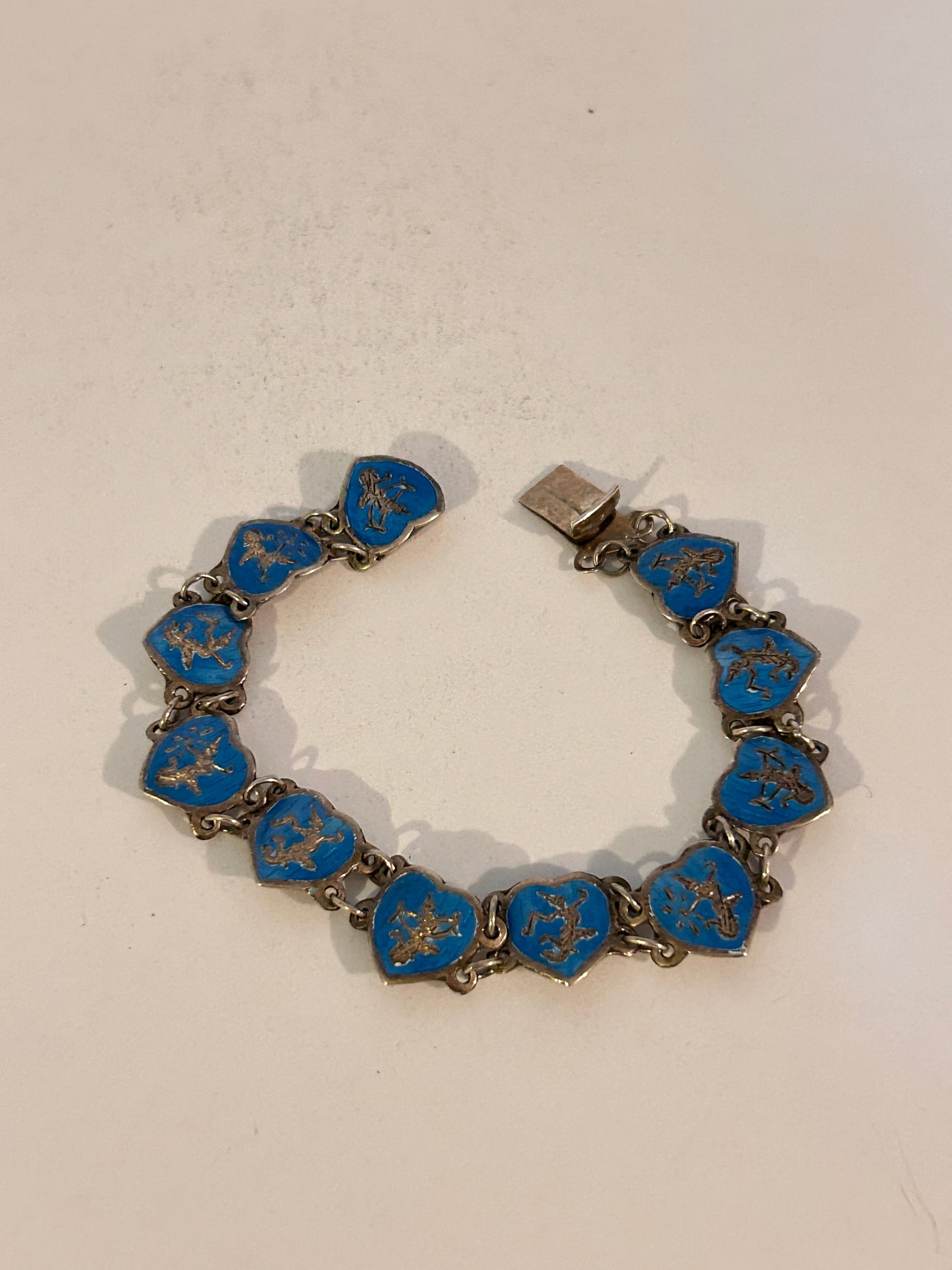 Vintage Siam Sterling Silver Heart Bracelet Blue Enamel 7": Vintage Siam Sterling Silver Heart Bracelet Blue Enamel 7" Please view all photos as they are part of the description and condition of this Item, Feel free to contact me with questions or picture requ