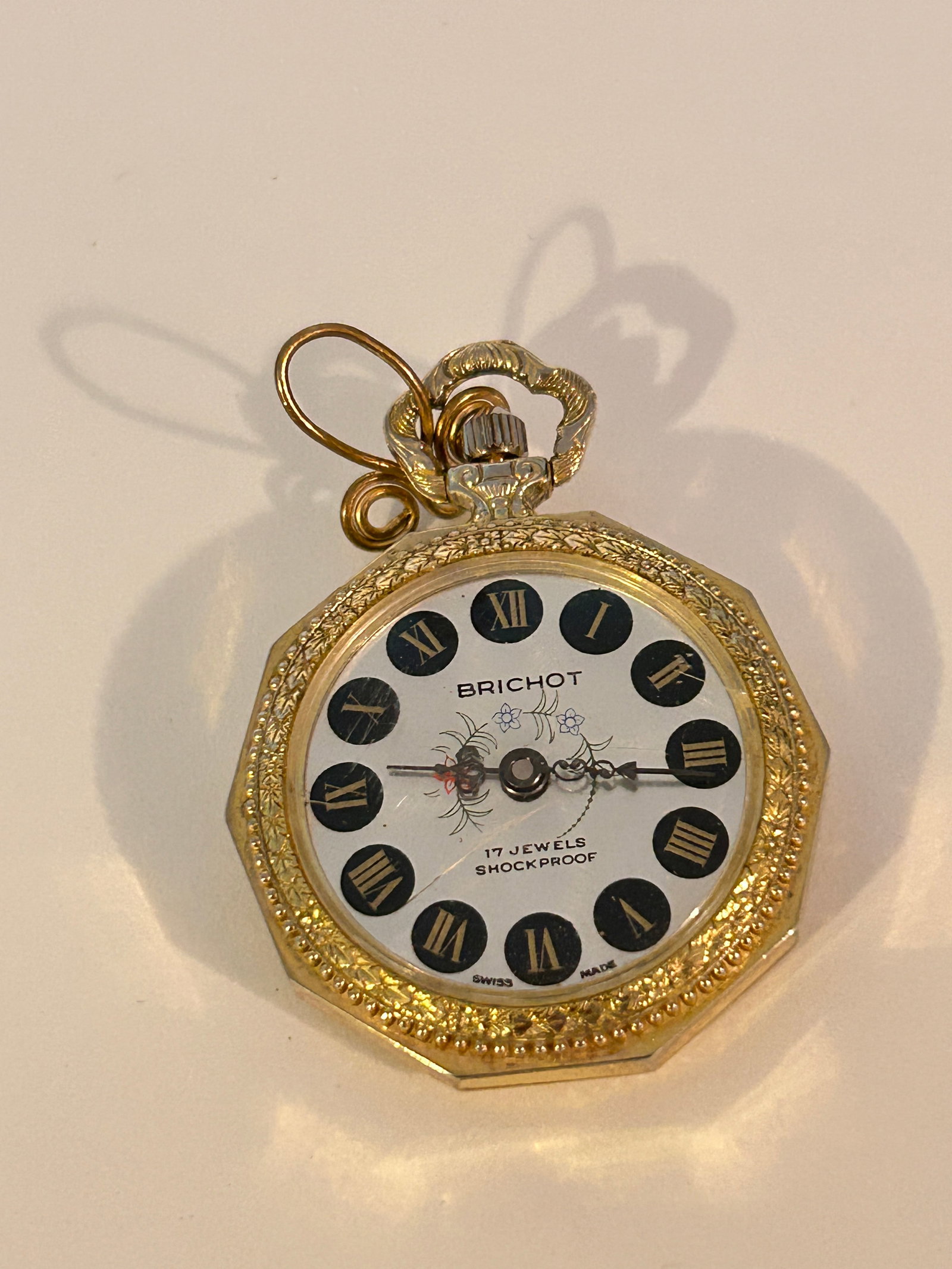 Vintage Brichot Wind-up Analog Gold Tone Pocket Pendant Watch working: Vintage Brichot Wind-up Analog Gold Tone Pocket Pendant Watch working Please view all photos as they are part of the description and condition of this Item, Feel free to contact me with questions or p