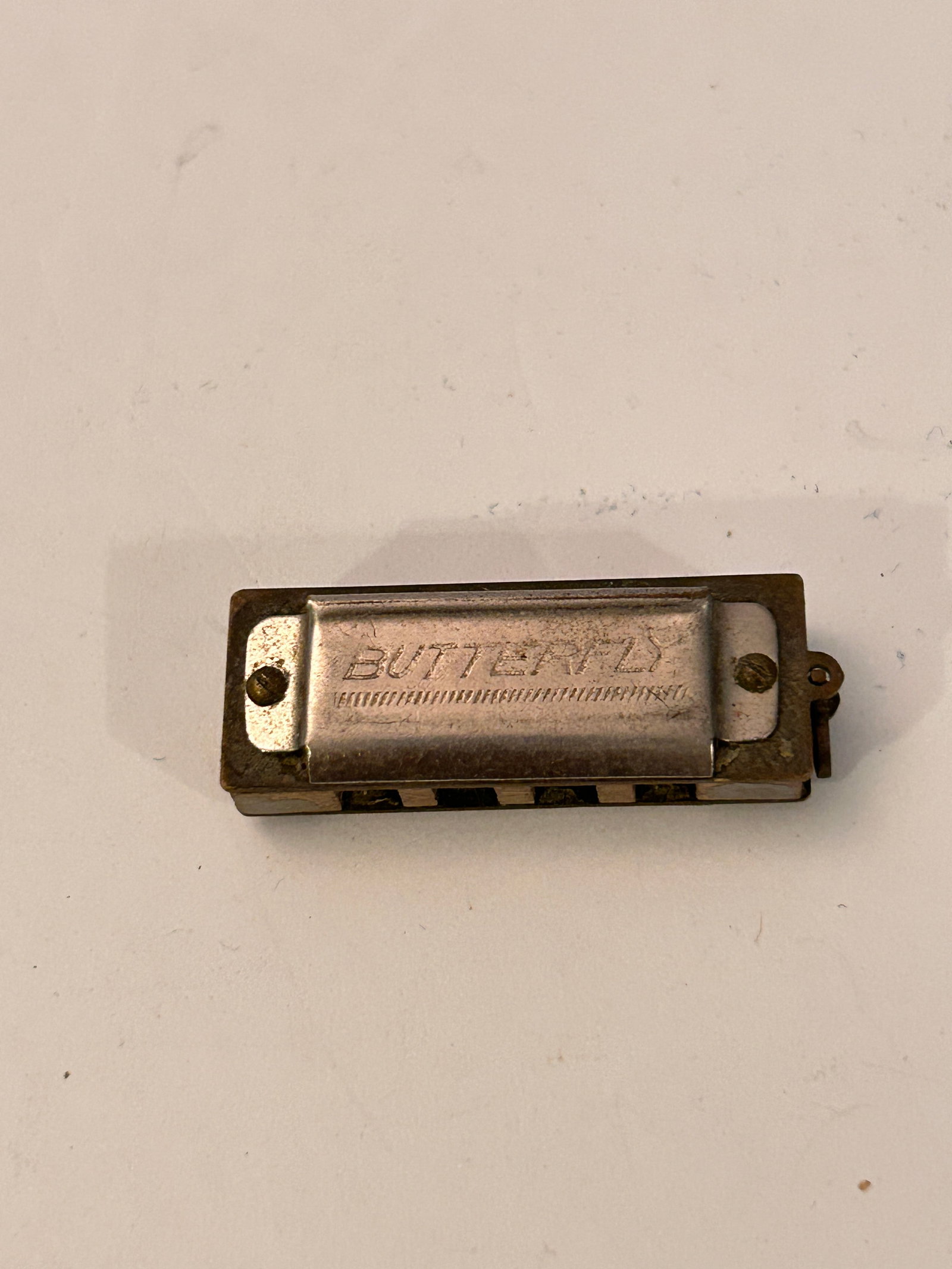 Miniature Medal Butterfly Mini-Harmonica - Made in Occupied Japan: Miniature Medal Butterfly Mini-Harmonica - Made in Occupied Japan Please view all photos as they are part of the description and condition of this Item, Feel free to contact me with questions or pictu