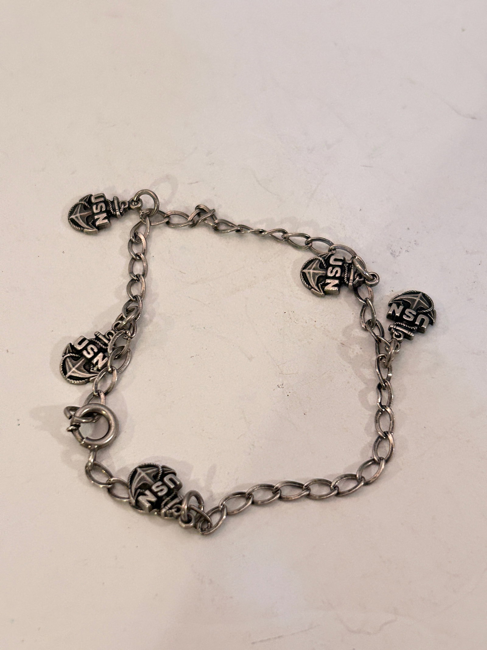Sterling Silver US Navy Wife Charm Bracelet 7": Sterling Silver US Navy Wife Charm Bracelet 7" Please view all photos as they are part of the description and condition of this Item, Feel free to contact me with questions or picture requests! Used I