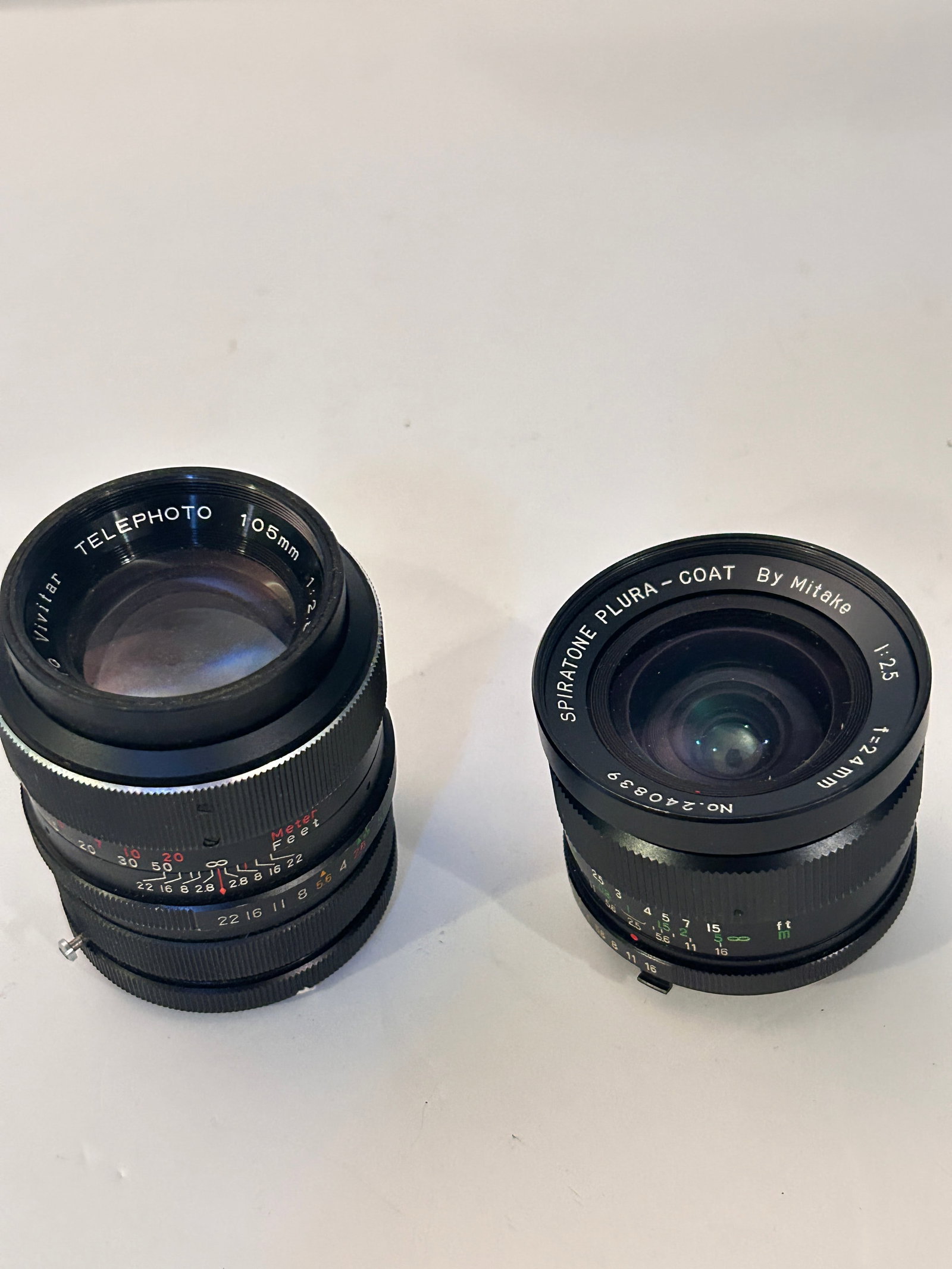 Pair of Vintage Camera Lenses Vivitar 105mm 2:8 & Spiritone Plura 2.5 24mm: Pair of Vintage Camera Lenses Vivitar 105mm 2:8 & Spiritone Plura 2.5 24mm Please view all photos as they are part of the description and condition of this Item, Feel free to contact me with questions