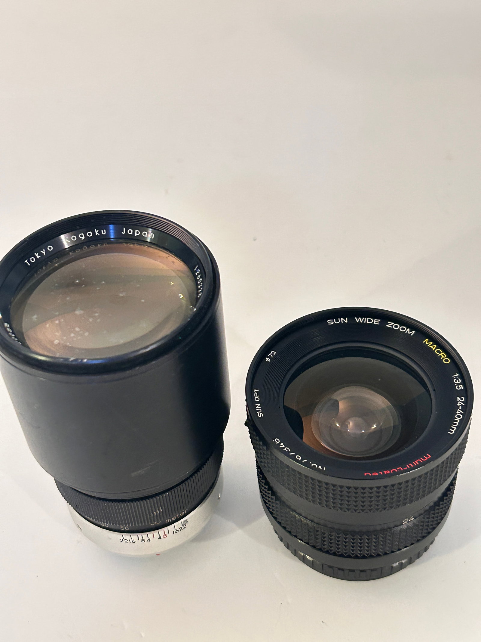 Pair of Vintage Camera Lenses Sun wide zoom 3.5 24-40mm & Topcor 1:4 200mm: Pair of Vintage Camera Lenses Sun wide zoom 3.5 24-40mm & Topcor 1:4 200mm Please view all photos as they are part of the description and condition of this Item, Feel free to contact me with questions