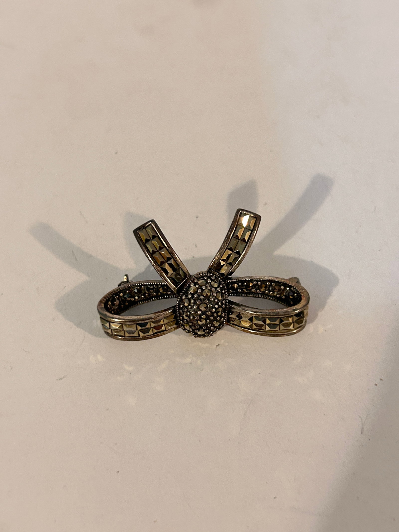 Vintage Sterling Silver Marcasite Bow Brooch 9 Grams: Vintage Sterling Silver Marcasite Bow Brooch 9 Grams Please view all photos as they are part of the description and condition of this Item, Feel free to contact me with questions or picture requests! 