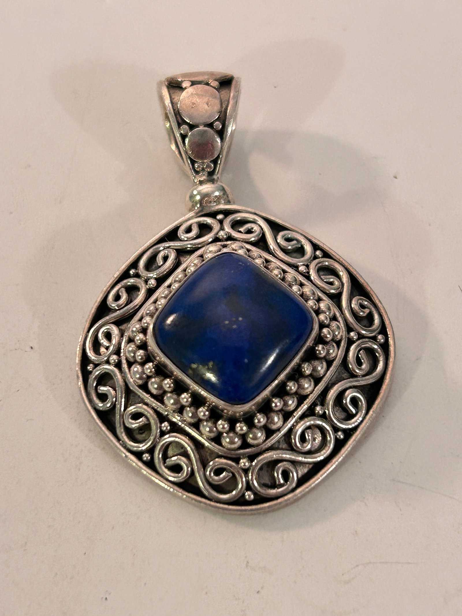 Suarti Bali Sterling 925 Silver Lapis Lazuli Swirl Pendant 24 grams: Suarti Bali Sterling 925 Silver Lapis Lazuli Swirl Pendant 24 grams Please view all photos as they are part of the description and condition of this Item, Feel free to contact me with questions or pic