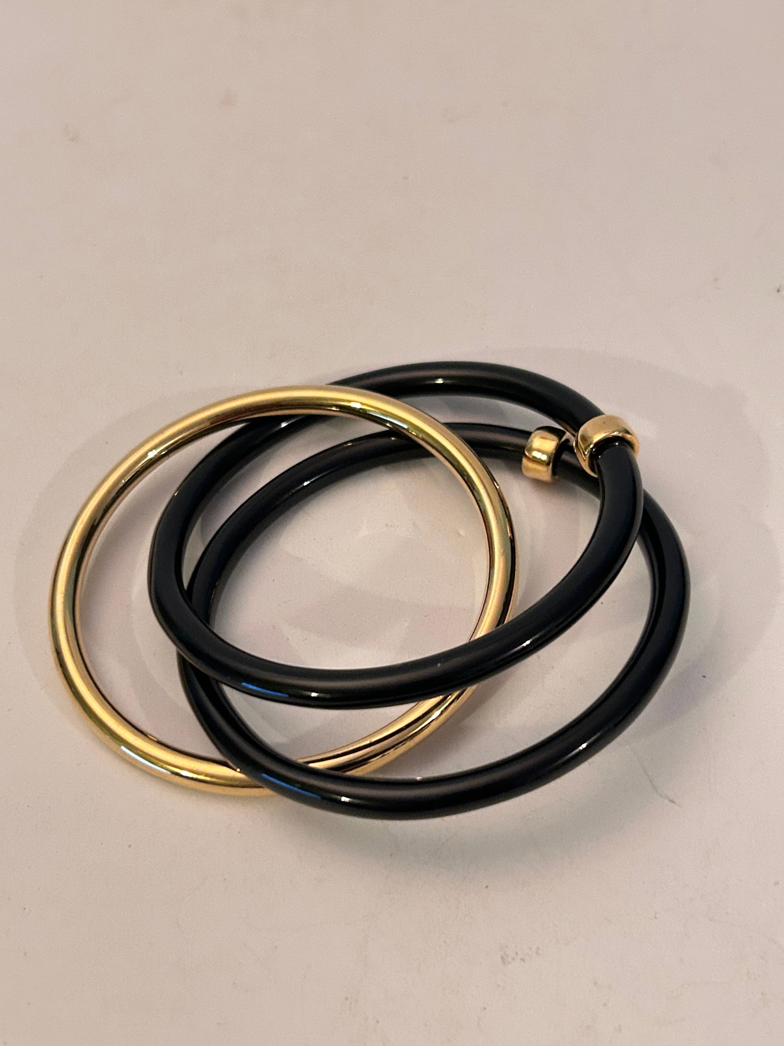 Vintage black & gold triple Bracelet: Vintage black & gold triple Bracelet Please view all photos as they are part of the description and condition of this Item, Feel free to contact me with questions or picture requests! Used Item AS IS