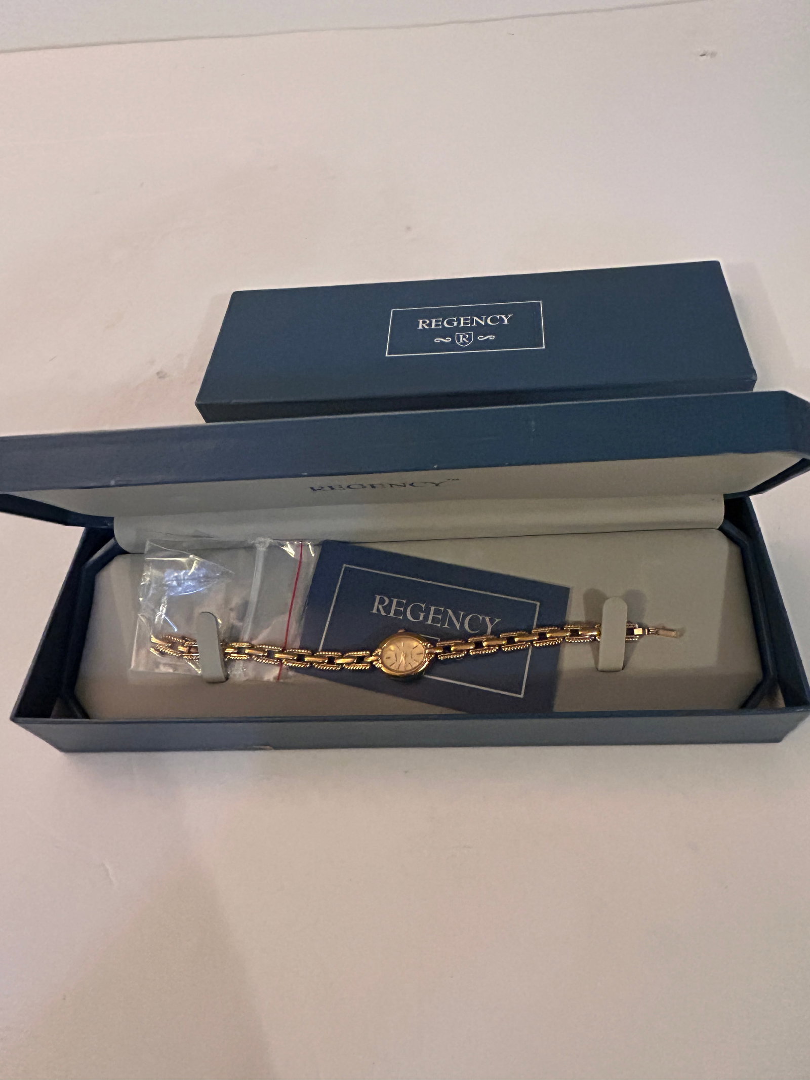 Regency Women Dress Gold Tone Oval Quartz Analog Watch works needs battery in box: Regency Women Dress Gold Tone Oval Quartz Analog Watch works needs battery in box Please view all photos as they are part of the description and condition of this Item, Feel free to contact me with qu