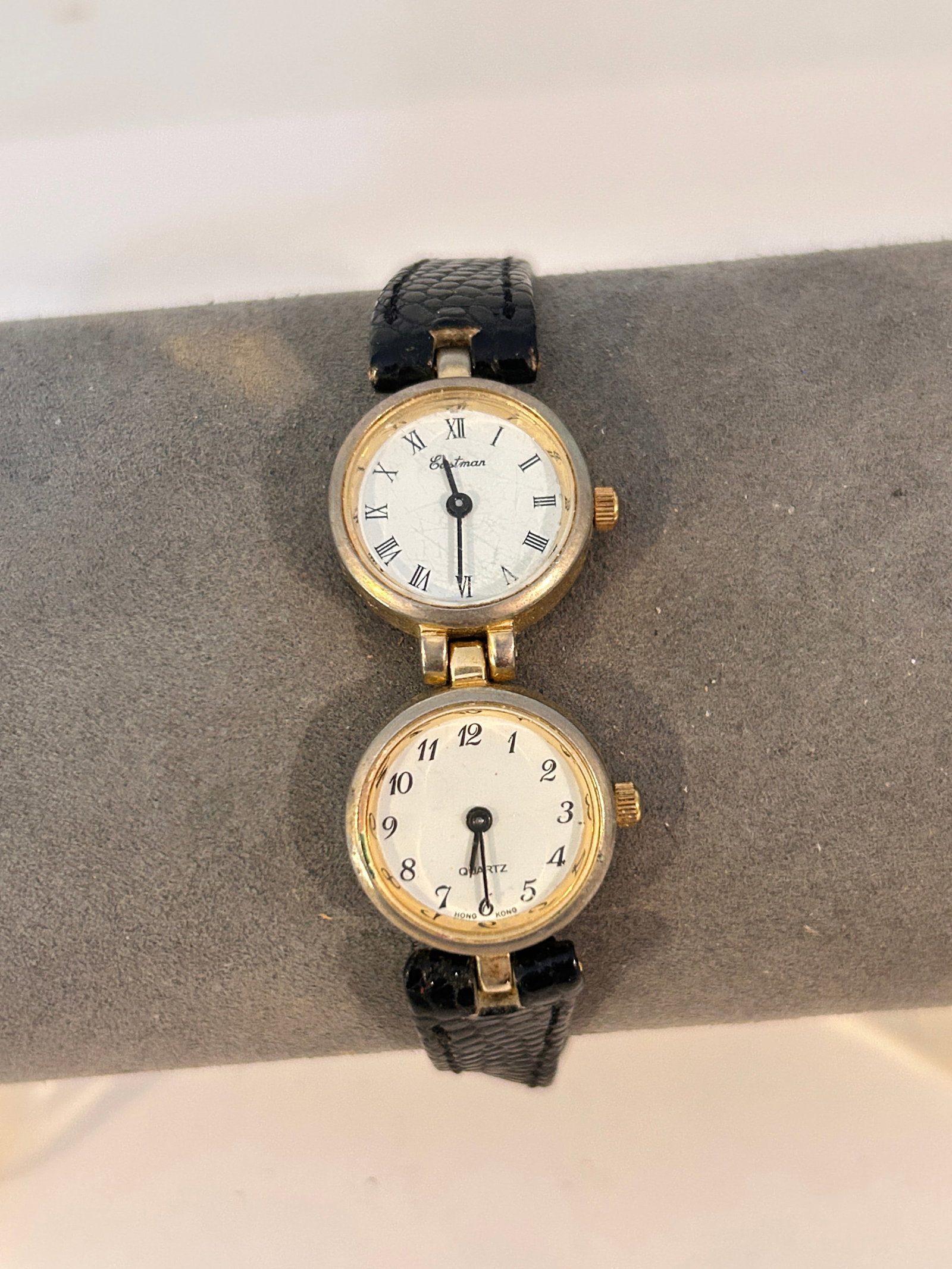 Eastman Analog 2-Face Watch Round White Face Gold Tone Black Band needs bat: Eastman Analog 2-Face Watch Round White Face Gold Tone Black Band needs bat Please view all photos as they are part of the description and condition of this Item, Feel free to contact me with question