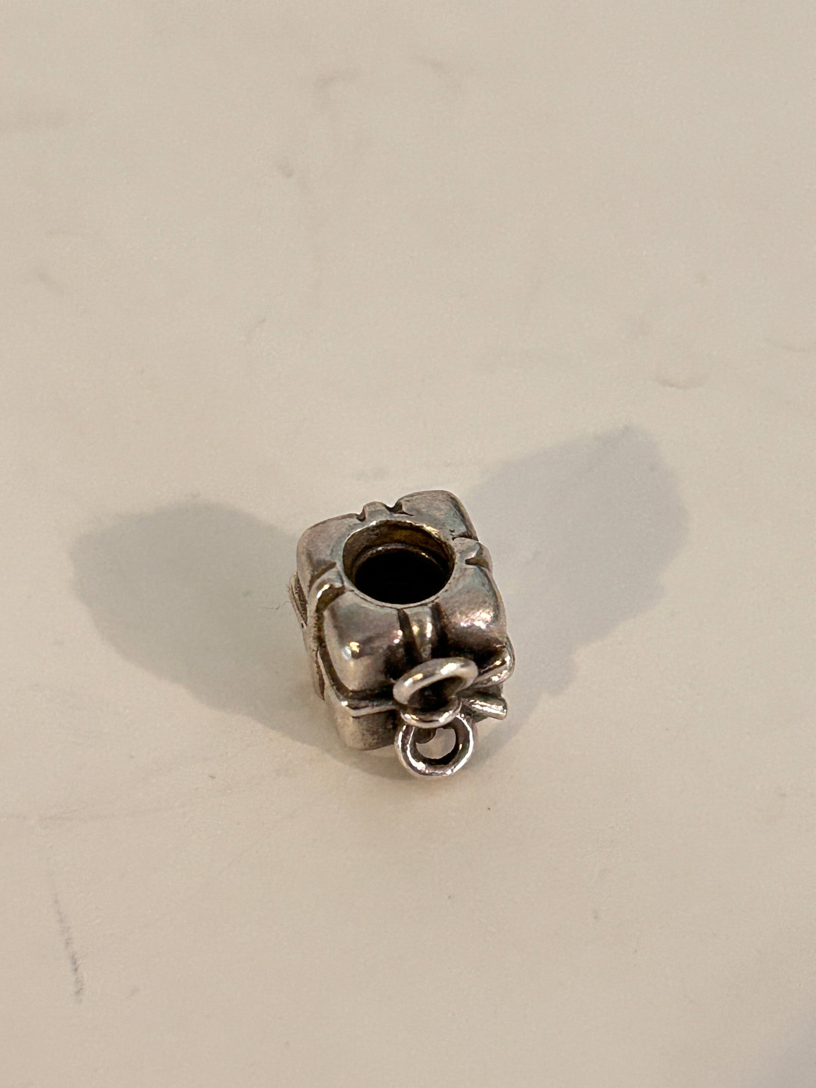 Authentic PANDORA Retired Sterling Silver Present Charm: Authentic PANDORA Retired Sterling Silver Present Charm Please view all photos as they are part of the description and condition of this Item, Feel free to contact me with questions or picture request