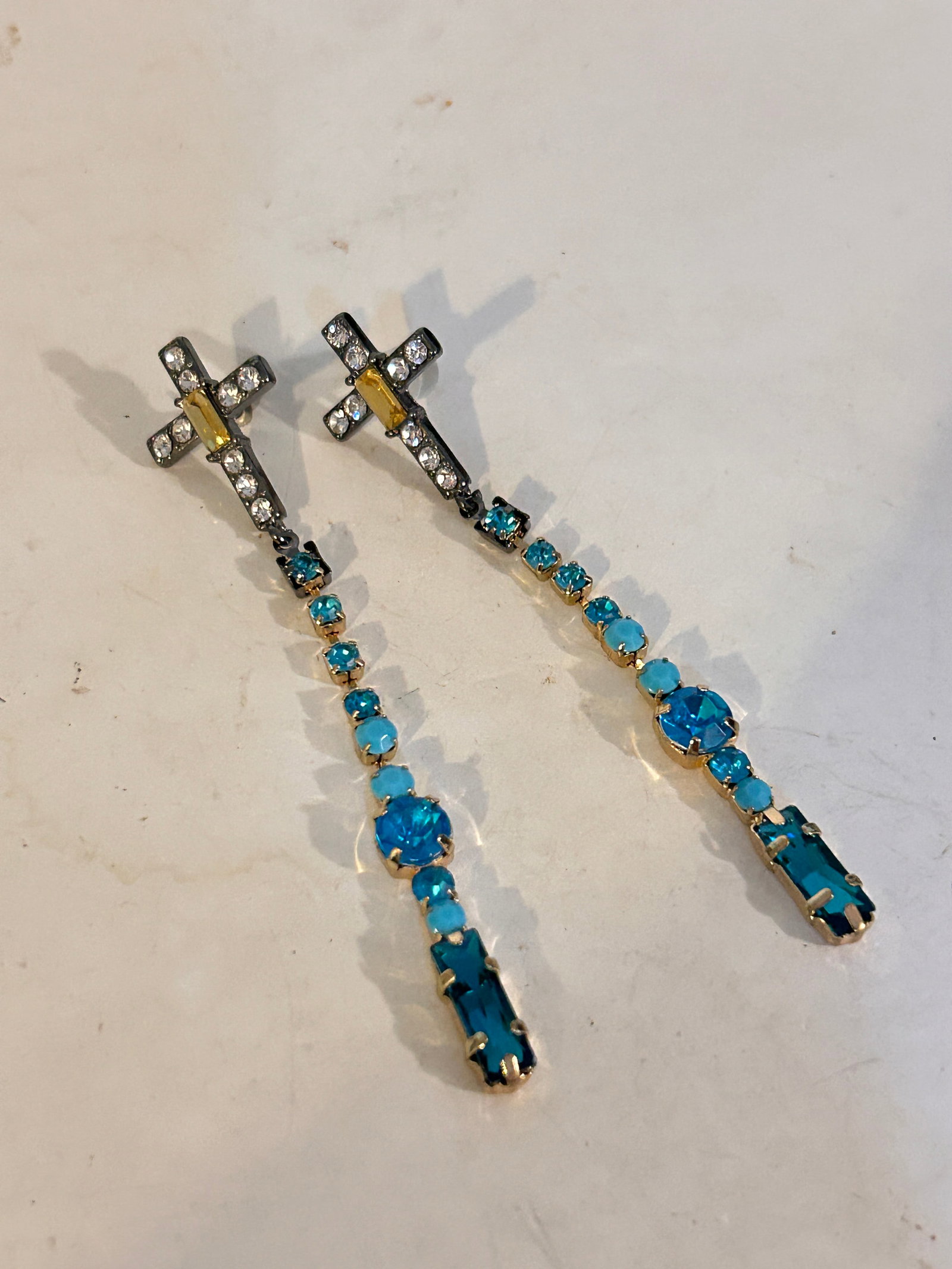 Vintage blue rhinestone cross Earrings: Vintage blue rhinestone cross EarringsPlease view all photos as they are part of the description and condition of this Item, Feel free to contact me with questions or picture requests! Used Item AS IS