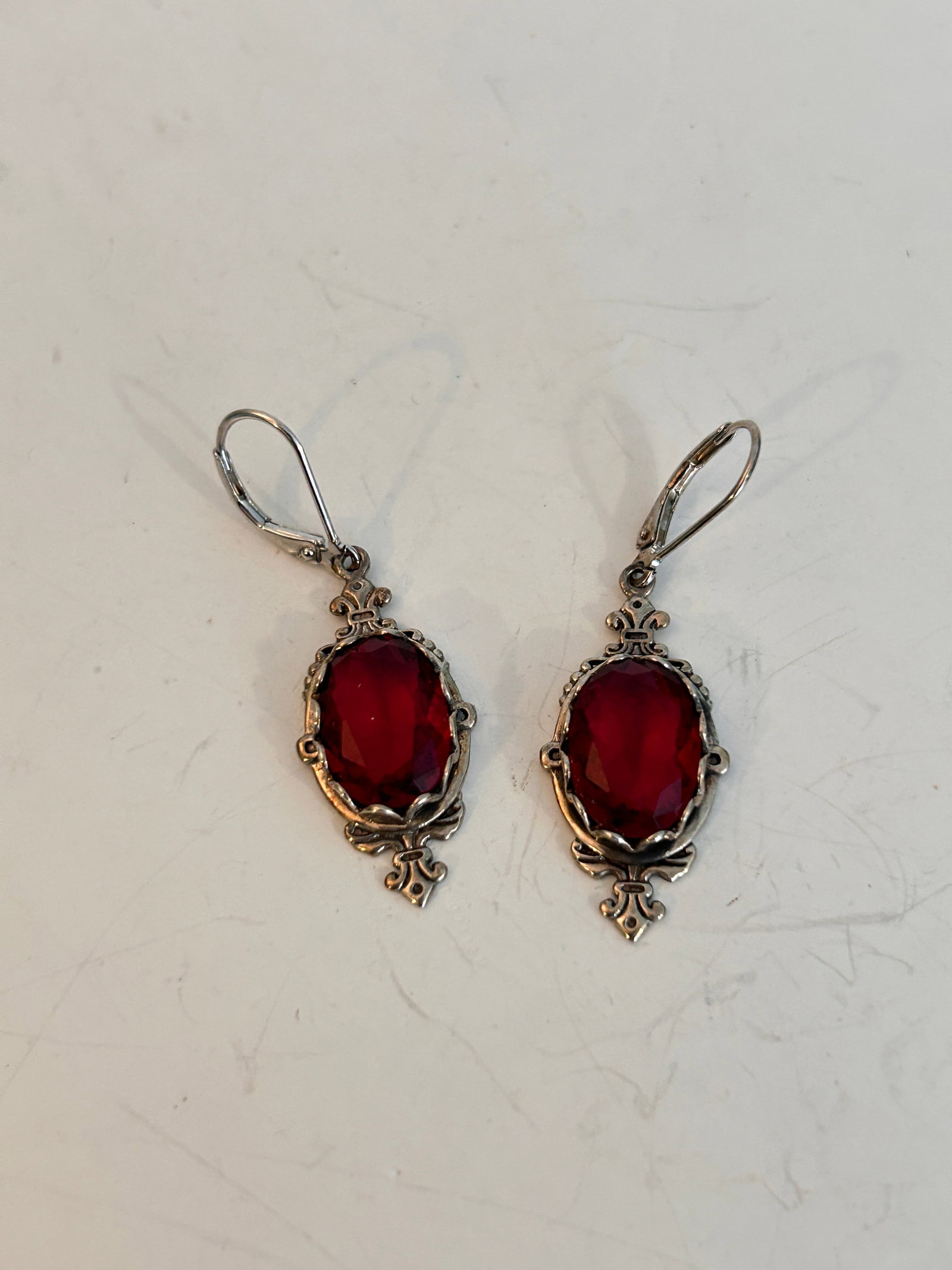 Vintage Sterling Silver red glass Earrings: Vintage Sterling Silver red glass Earrings Please view all photos as they are part of the description and condition of this Item, Feel free to contact me with questions or picture requests! Used Item 