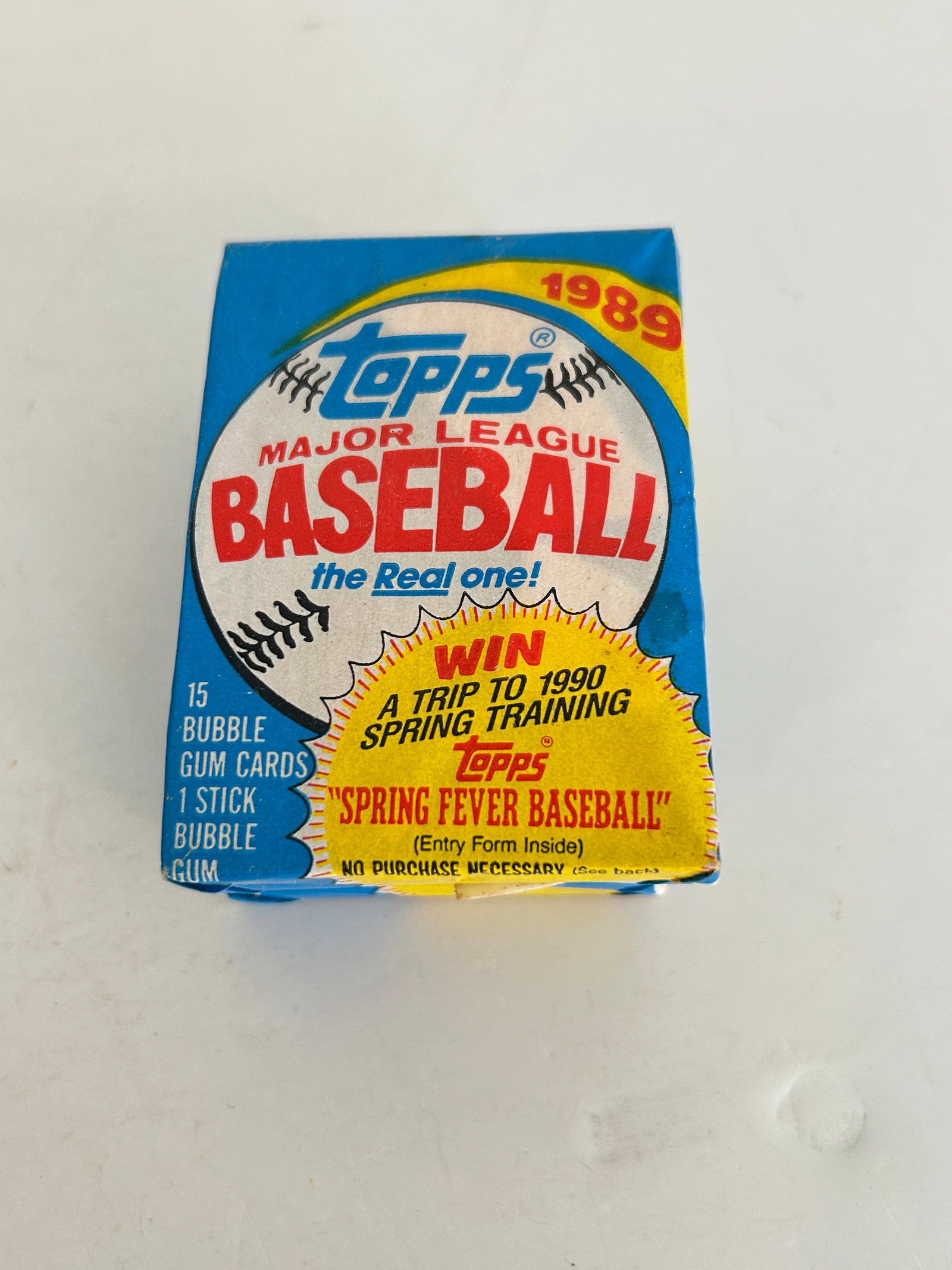 Unopened 1989 Topps Major League Baseball wax pack featuring a "Spring Fever Baseball" (1 of 2)