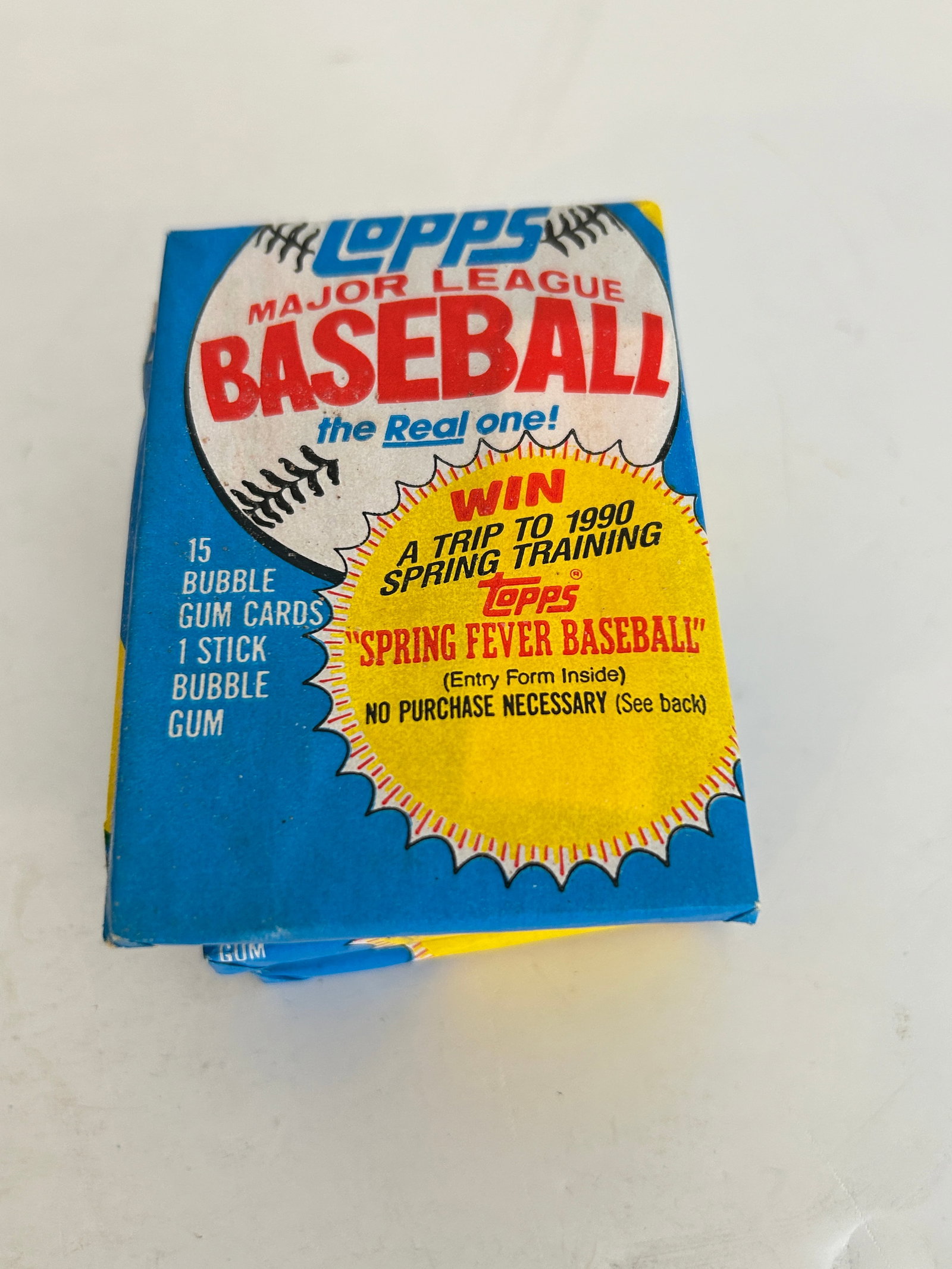Unopened 1989 Topps Major League Baseball wax pack featuring a "Spring Fever Baseball" (1 of 2)