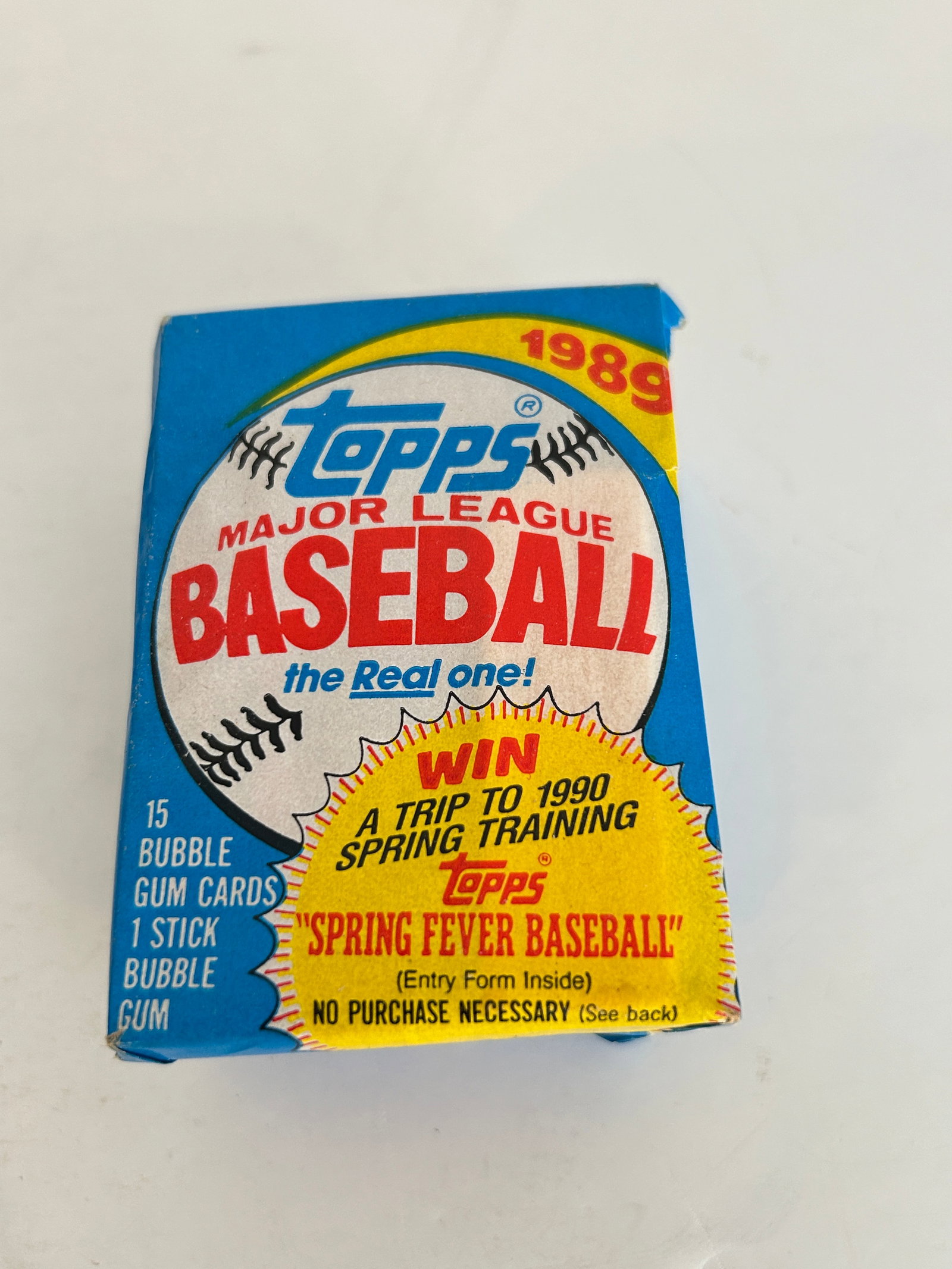 Unopened 1989 Topps Major League Baseball wax pack featuring a "Spring Fever Baseball" (1 of 2)