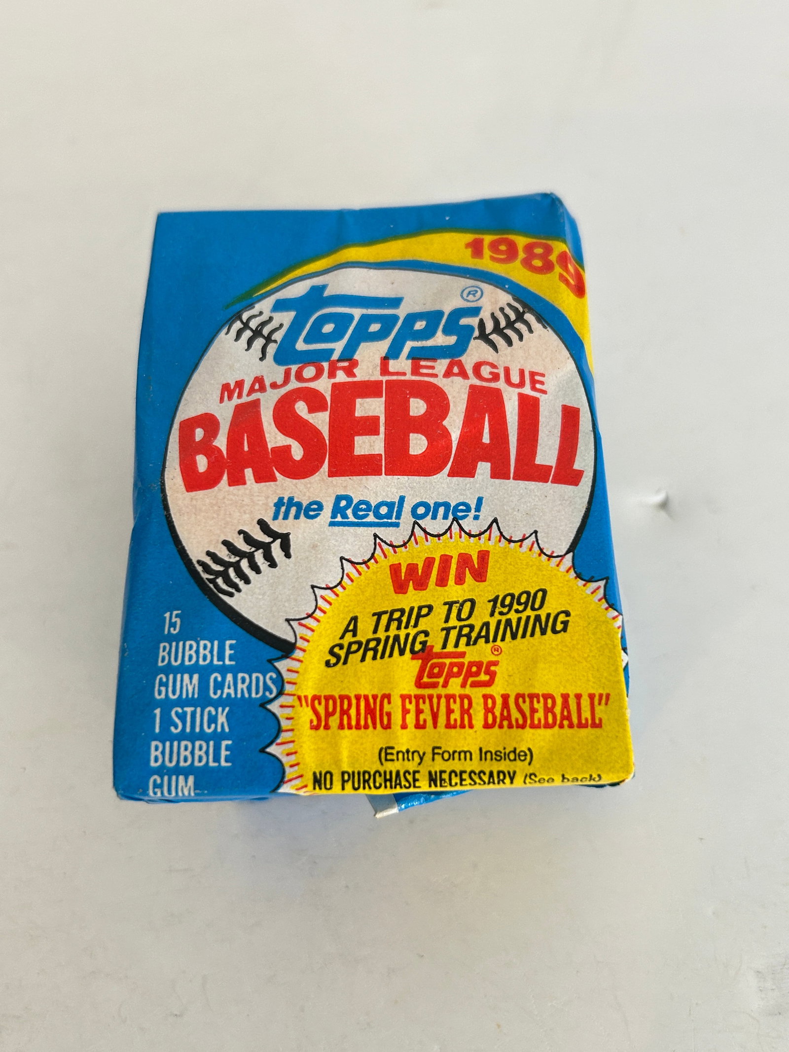 Unopened 1989 Topps Major League Baseball wax pack featuring a "Spring Fever Baseball" (1 of 2)