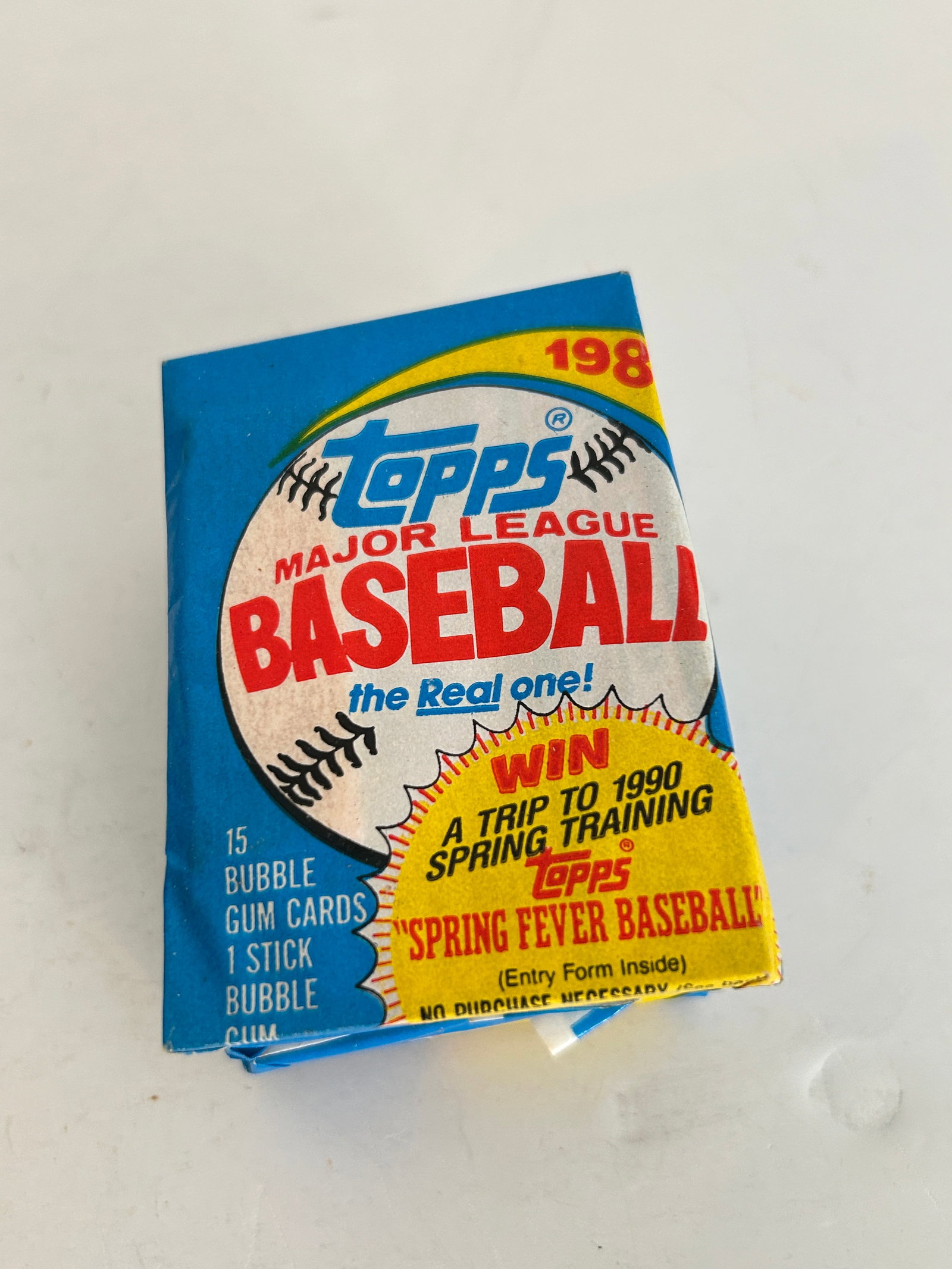 Unopened 1989 Topps Major League Baseball wax pack featuring a "Spring Fever Baseball" (1 of 2)