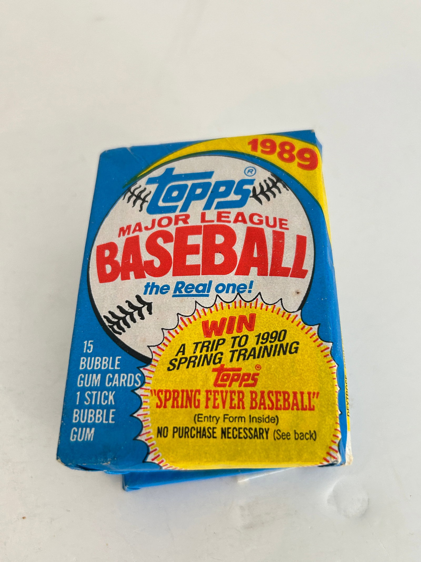 Unopened 1989 Topps Major League Baseball wax pack featuring a "Spring Fever Baseball" (1 of 2)