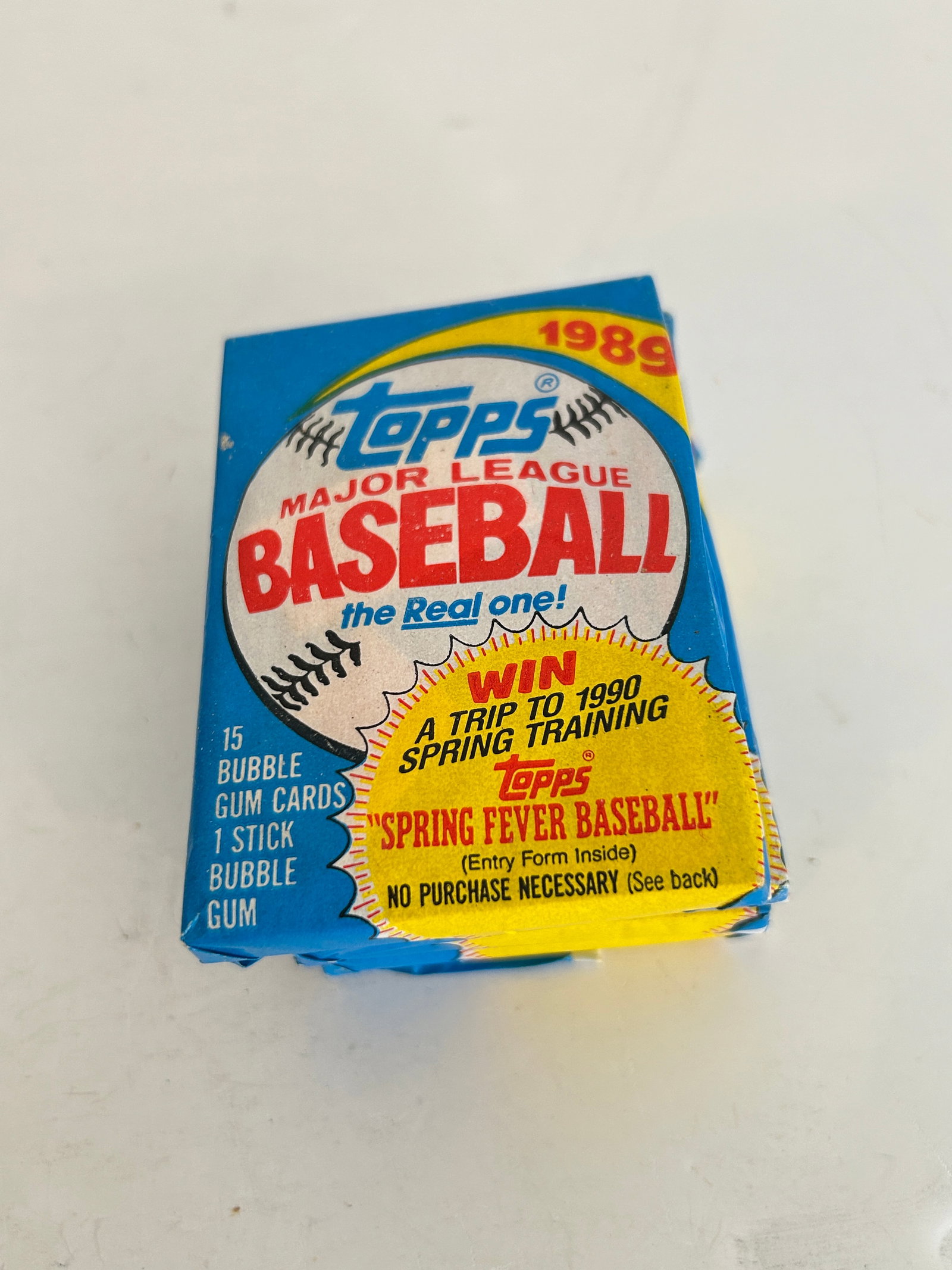 Unopened 1989 Topps Major League Baseball wax pack featuring a "Spring Fever Baseball" (1 of 2)