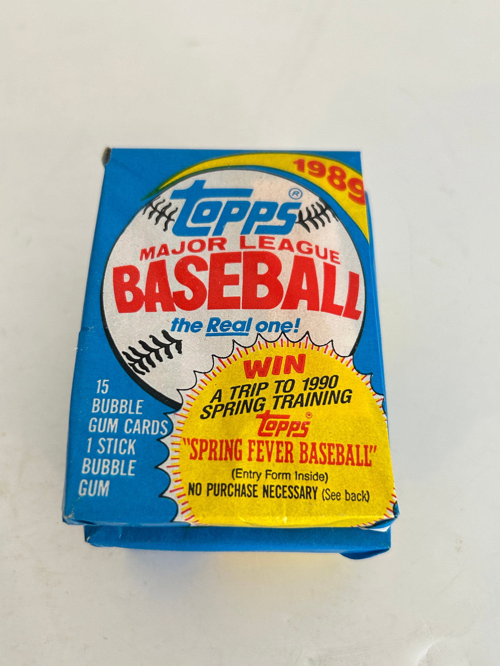 Unopened 1989 Topps Major League Baseball wax pack featuring a "Spring Fever Baseball" (1 of 2)