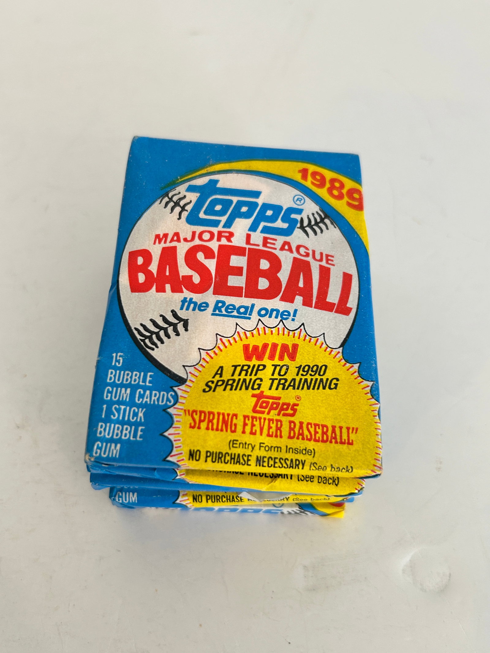 Unopened 1989 Topps Major League Baseball wax pack featuring a "Spring Fever Baseball" (1 of 2)