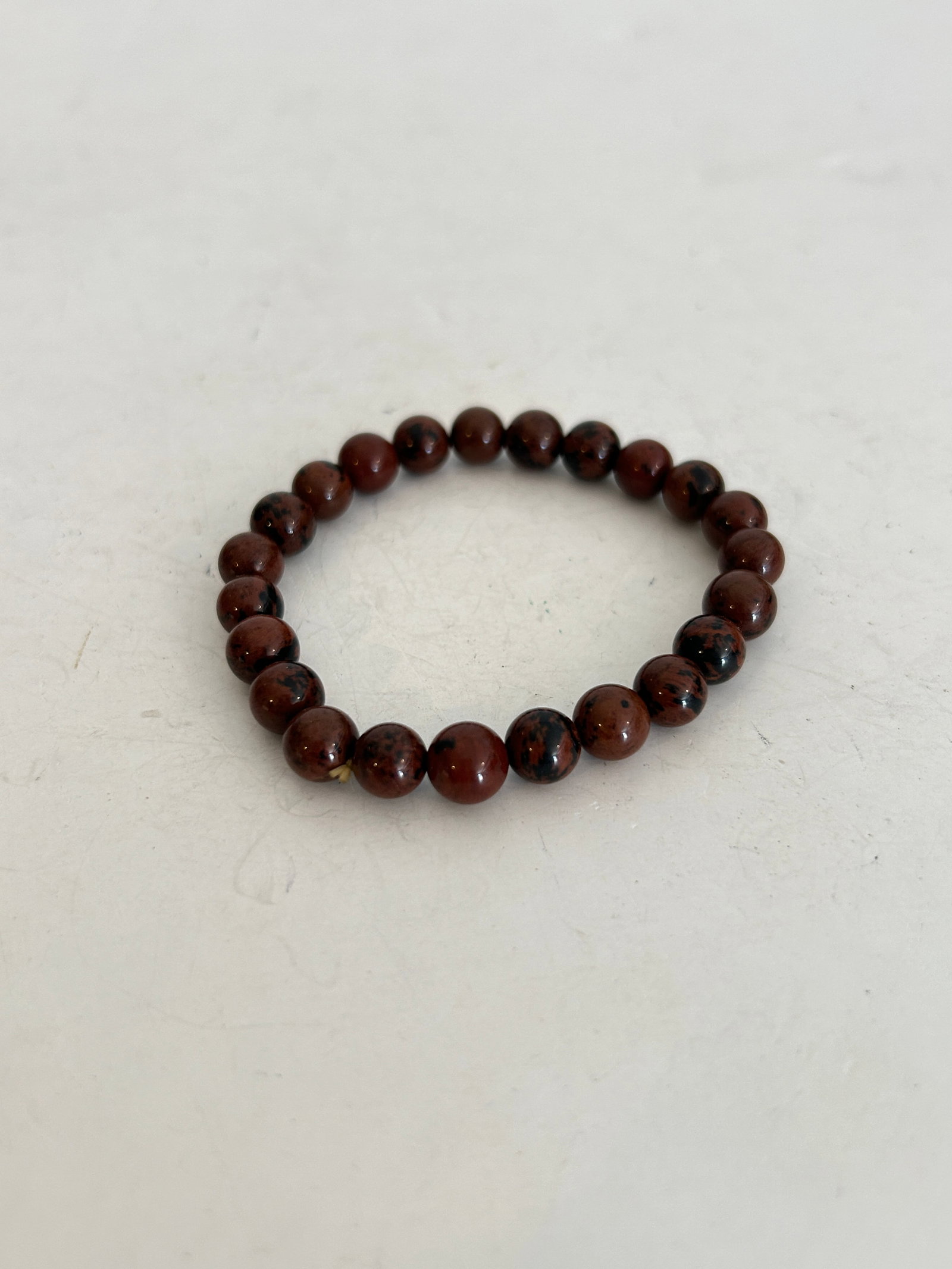 Vintage Mahogany Obsidian Stretch Bracelet: Vintage Mahogany Obsidian Stretch Bracelet Please view all photos as they are part of the description and condition of this Item, Feel free to contact me with questions or picture requests! Used Item 