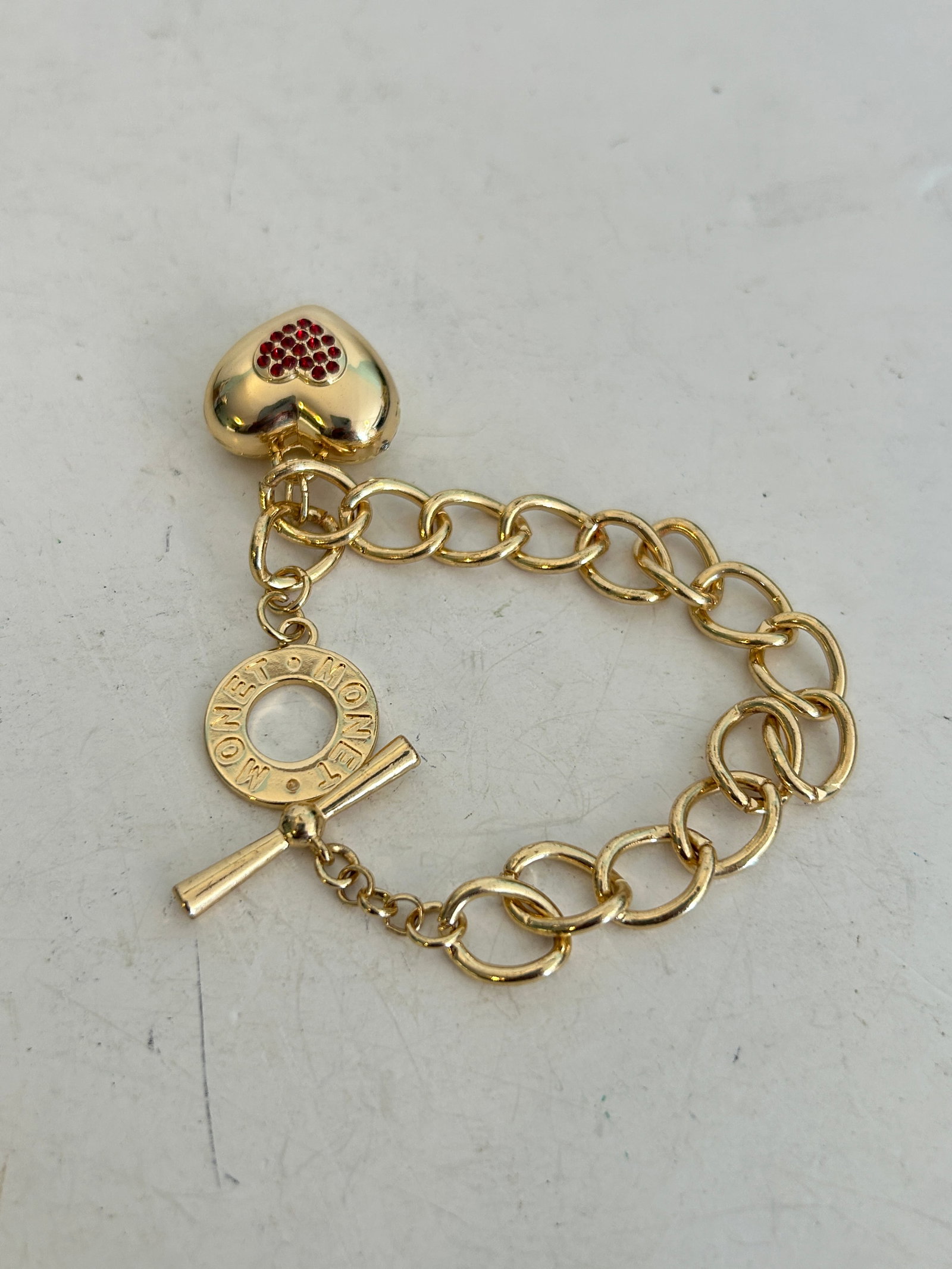 Monet Gold Link Toggle 7.5" Bracelet Red Pave Set Rhinestone Puffed Heart Charm: Monet Gold Link Toggle 7.5" Bracelet Red Pave Set Rhinestone Puffed Heart Charm Please view all photos as they are part of the description and condition of this Item, Feel free to contact me with ques